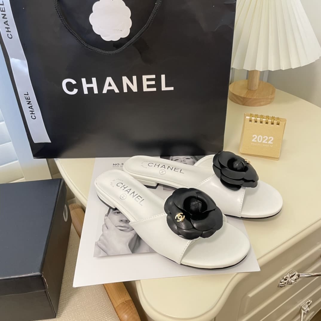 Chanel Black Camellia Slides White
