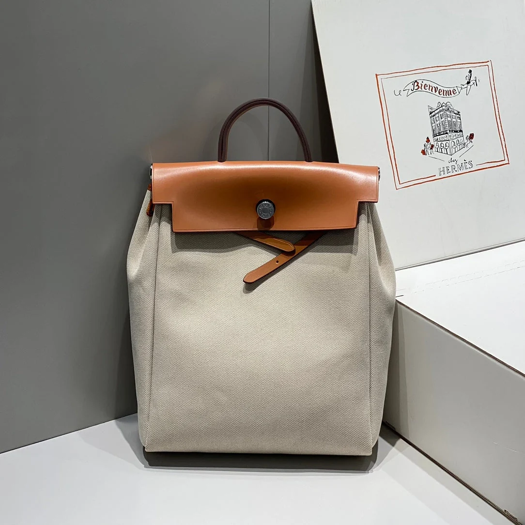 HERBAG A DOS ZIP RETOURNE BACKPACK 29 IN OFF-WHITE CANVAS AND BROWN CALFSKIN