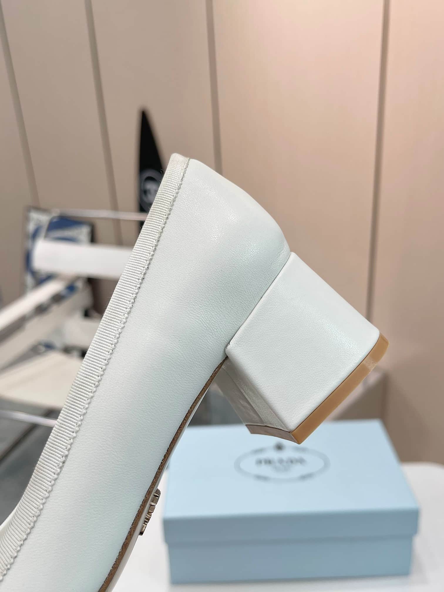 Prada Triangle Logo Bow Pump In White