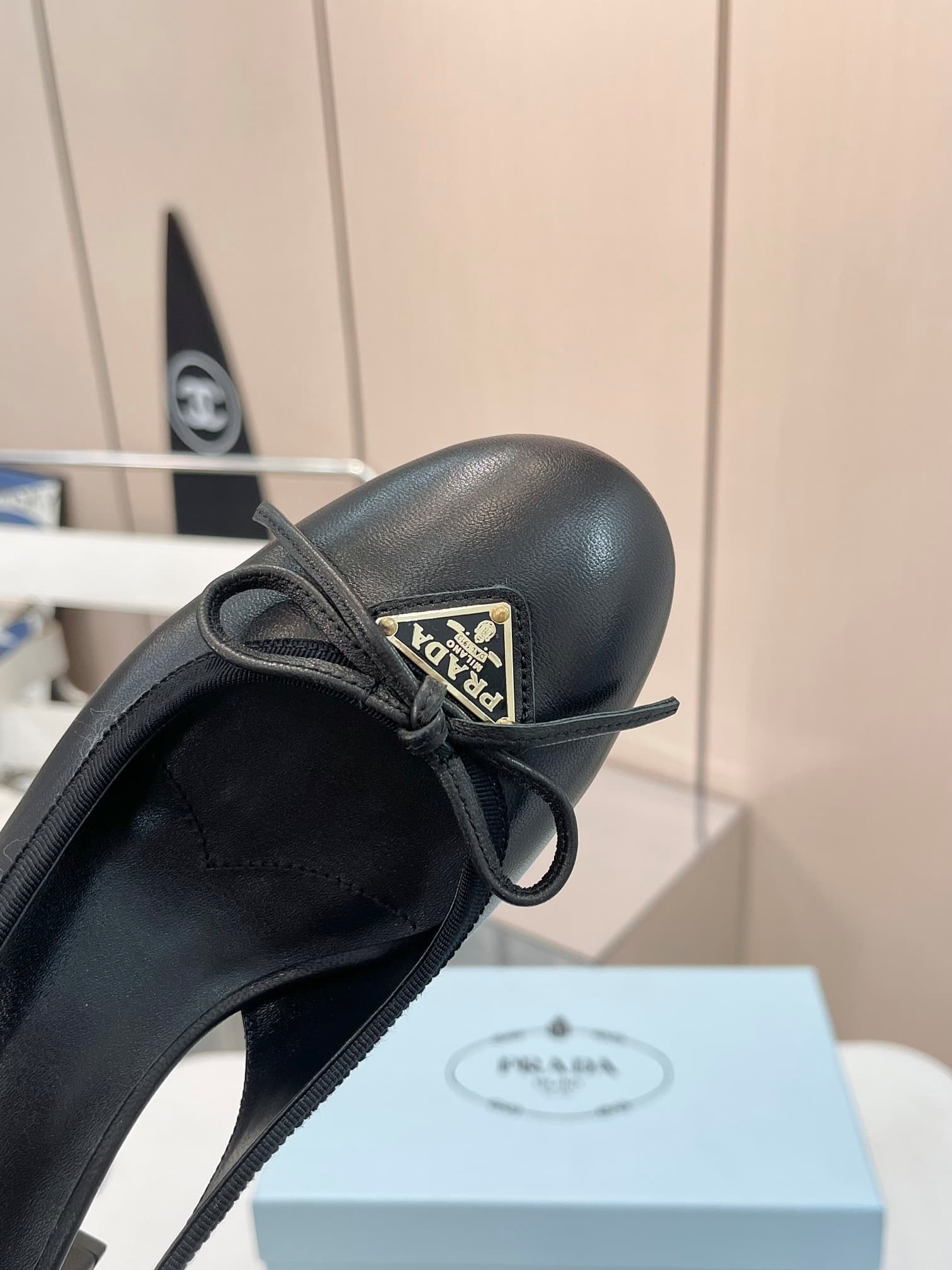Prada Triangle Logo Bow Slingback Pump In Black