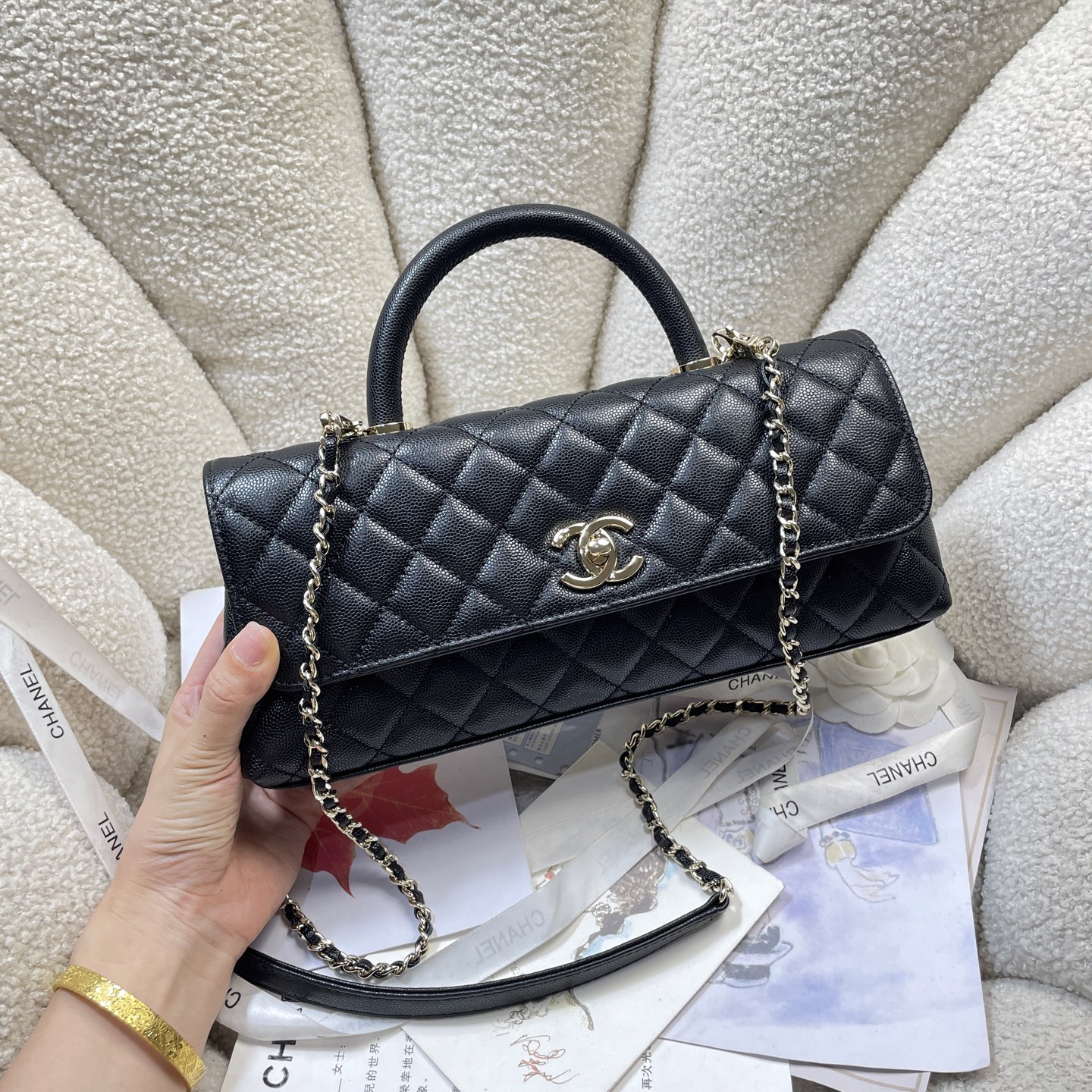 Spring-Summer 2026 Black Quilted Caviar Calfskin Top Handle Flap Bag with Gold-Tone Hardware