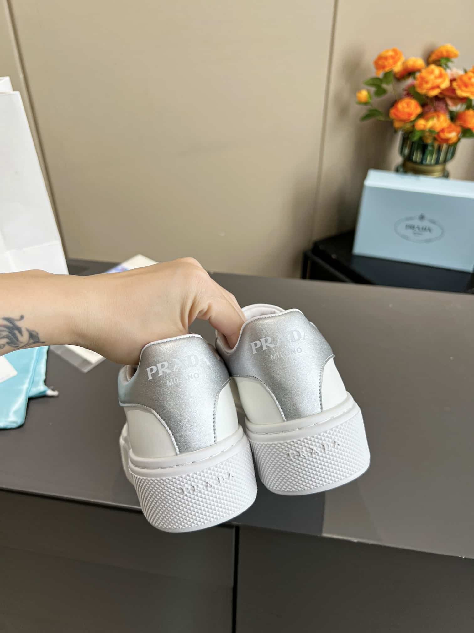 Prada Sneaker In White Leather With Silver Logo