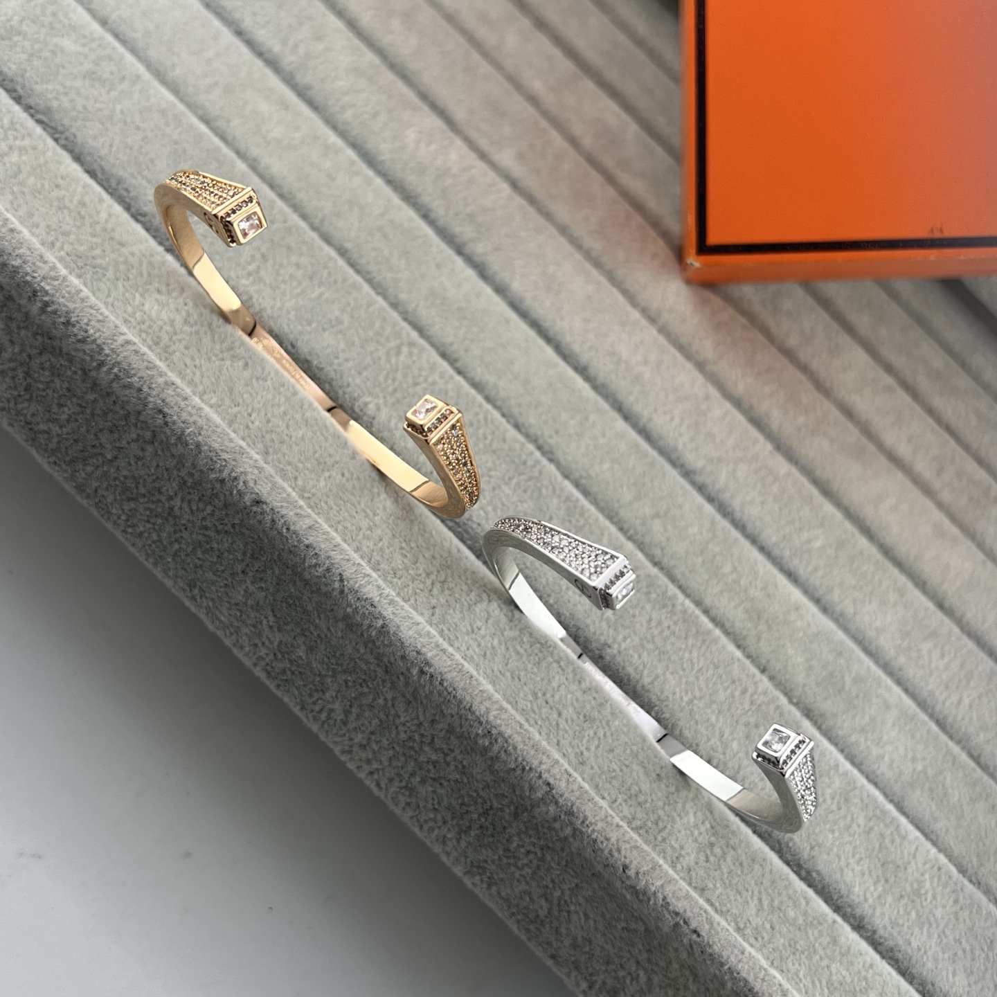 Square, trapezoidal, and conical diamond-encrusted bracelets