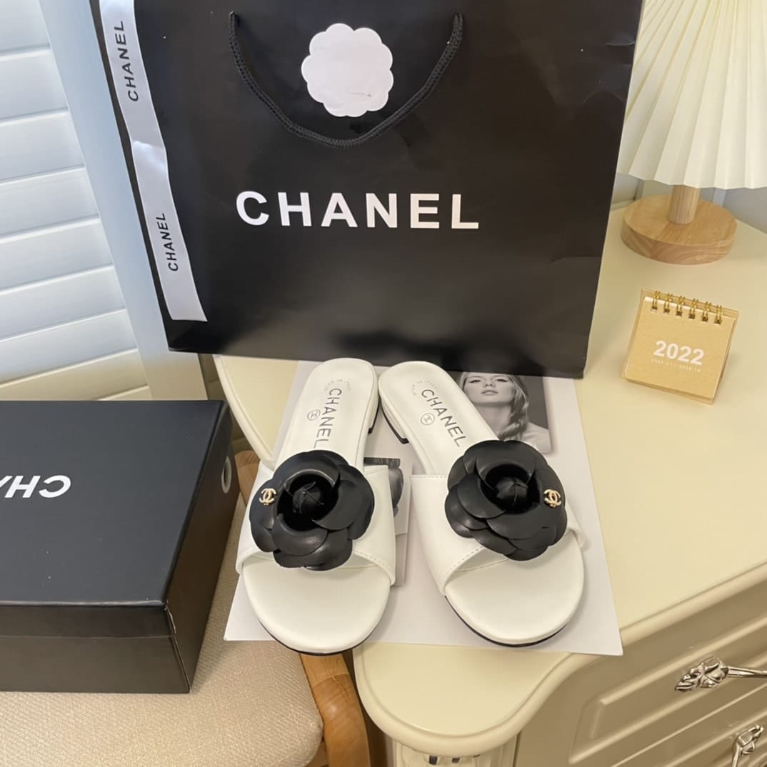 Chanel Black Camellia Slides White