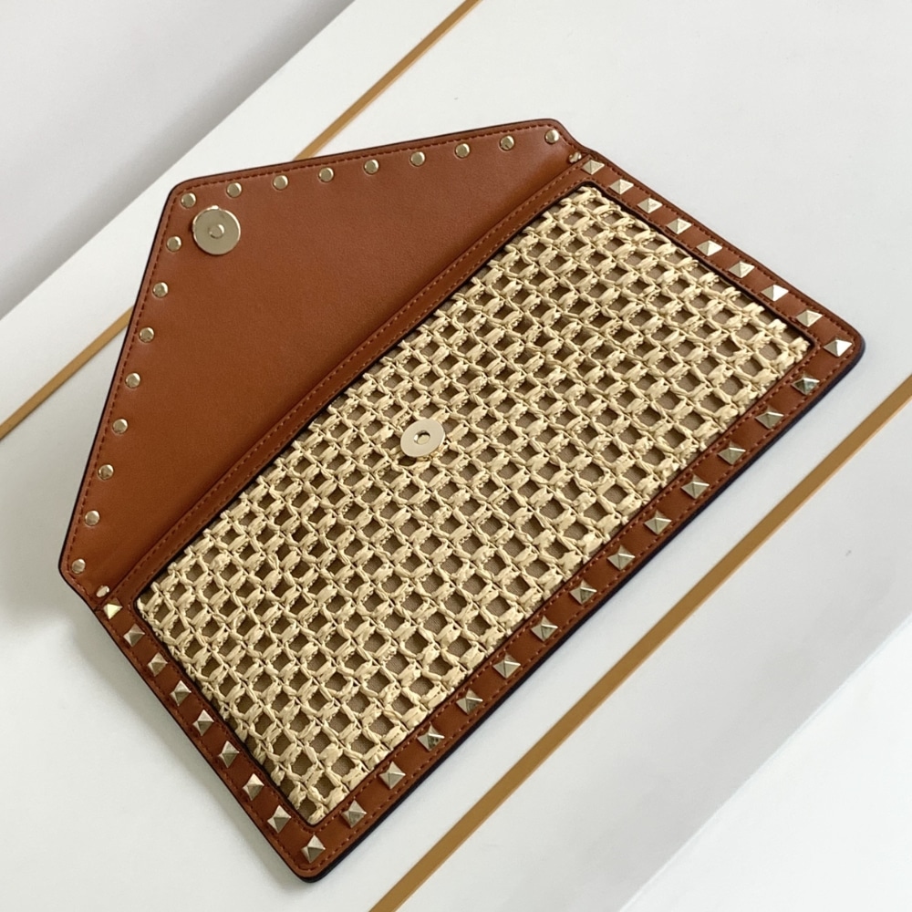 Valentino Garavani Rockstud Raffia Clutch Bag In Brown 28Cm