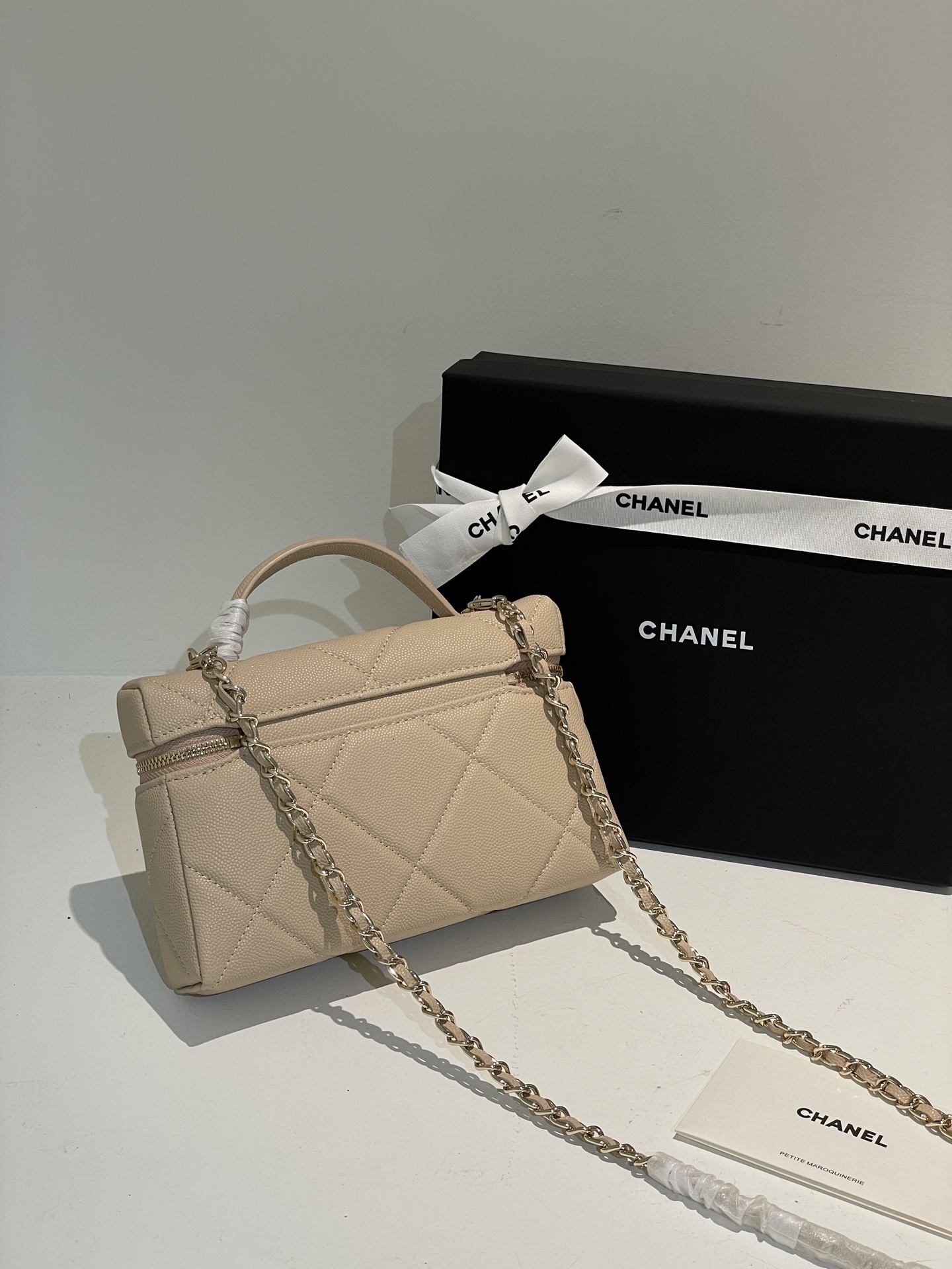 Beige Quilted Caviar Calfskin Vanity Case with Top Handle and Gold-Tone Chain Strap