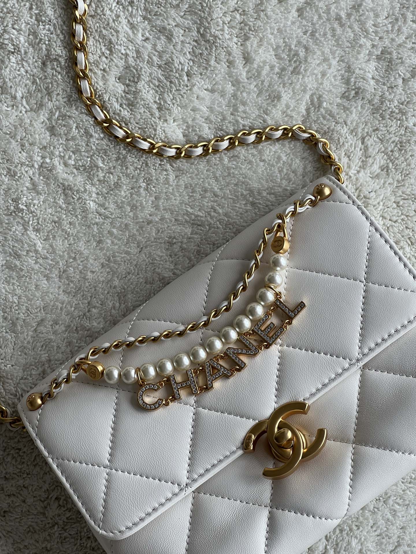 24A Mini Classic Flap Bag in White Quilted Lambskin with Pearl & Crystal CHANEL Letter Chain and Light Gold-Tone Hardware (AS4997)