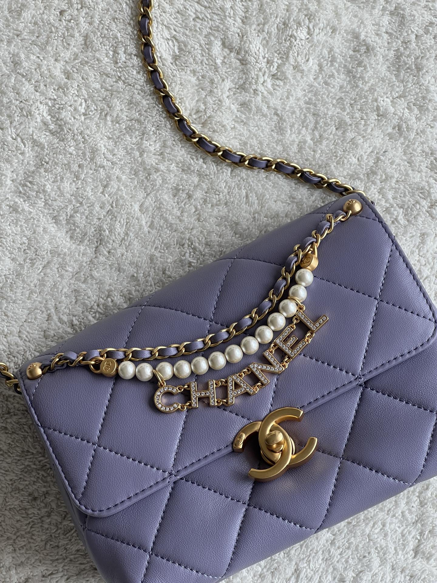 24A Mini Classic Flap Bag in Tato Purple Quilted Lambskin with Pearl & Crystal CHANEL Letter Chain and Light Gold-Tone Hardware (AS4997)