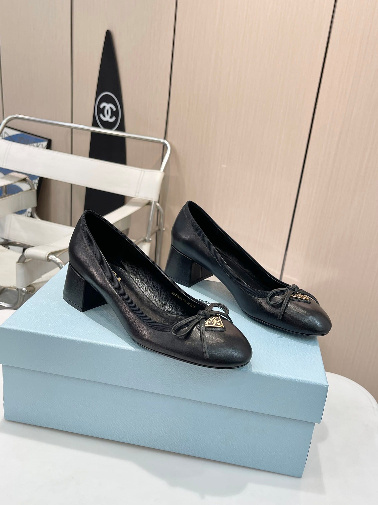 Prada Triangle Logo Bow Pump In Black
