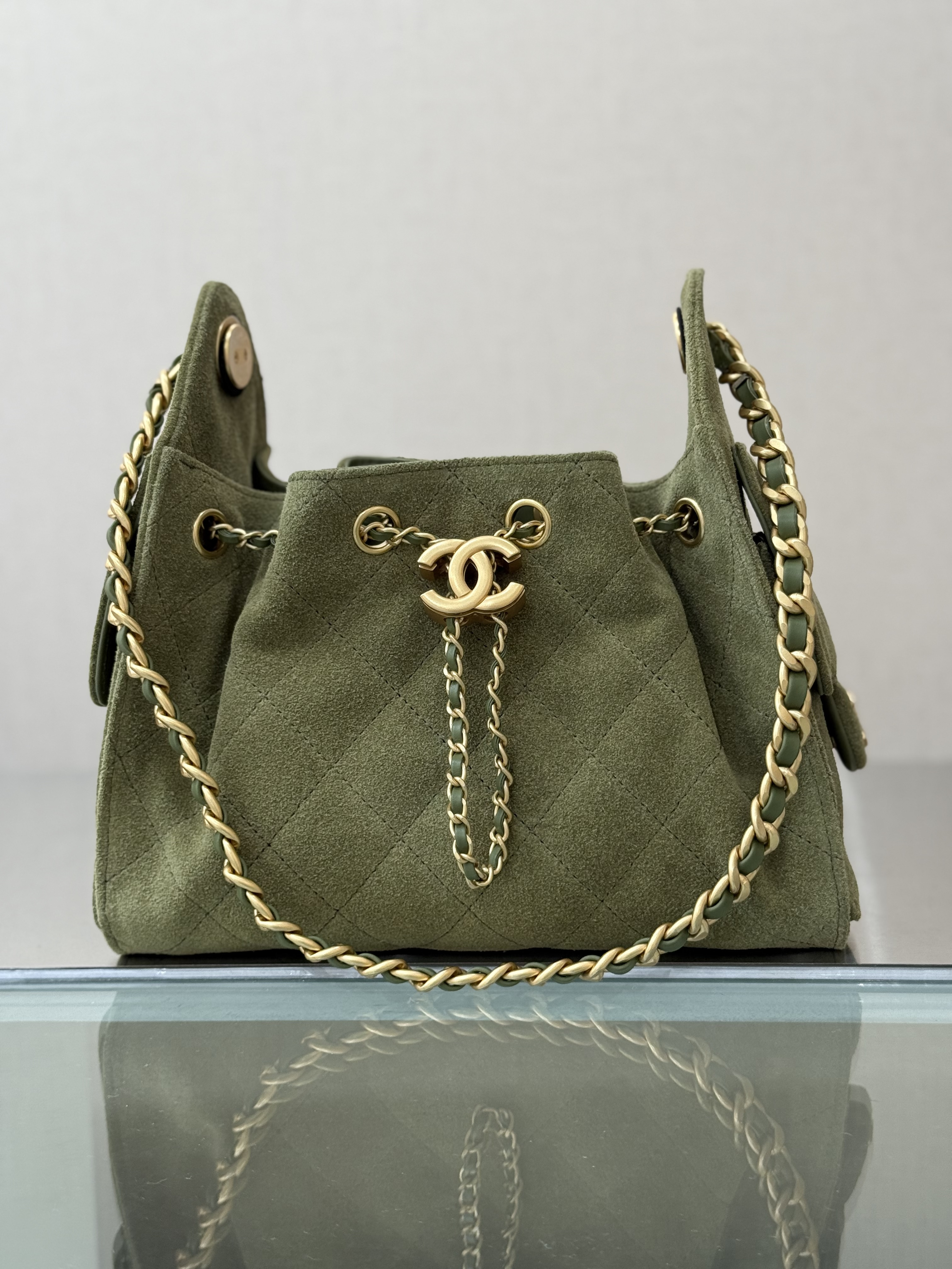 Spring-Summer 2025 Olive Green Quilted Suede Calfskin Drawstring Bucket Bag with Gold-Tone Hardware