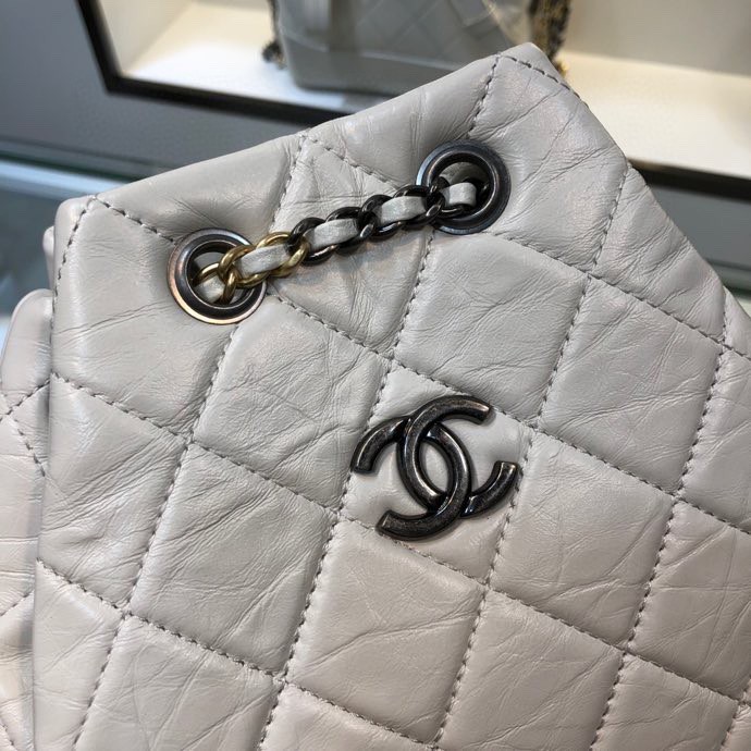 Gabrielle Small Quilted Aged Calfskin Backpack in White & Black