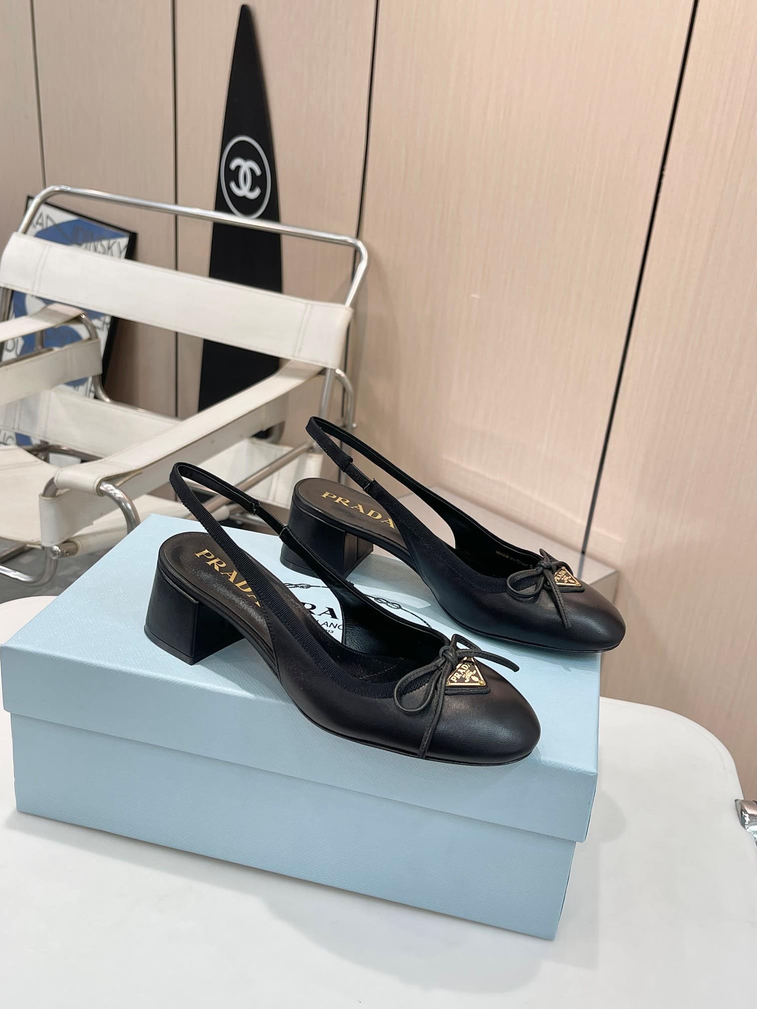 Prada Triangle Logo Bow Slingback Pump In Black