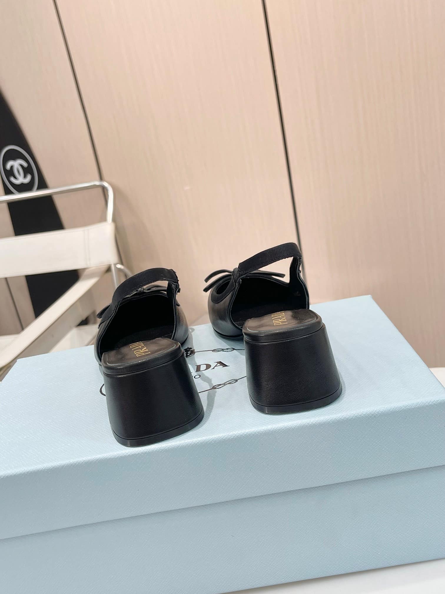 Prada Triangle Logo Bow Slingback Pump In Black