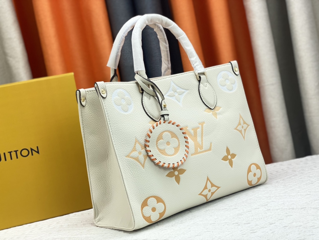Louis Vuitton On The Go Mm Monogram Empreinte Leather White 34Cm M45717