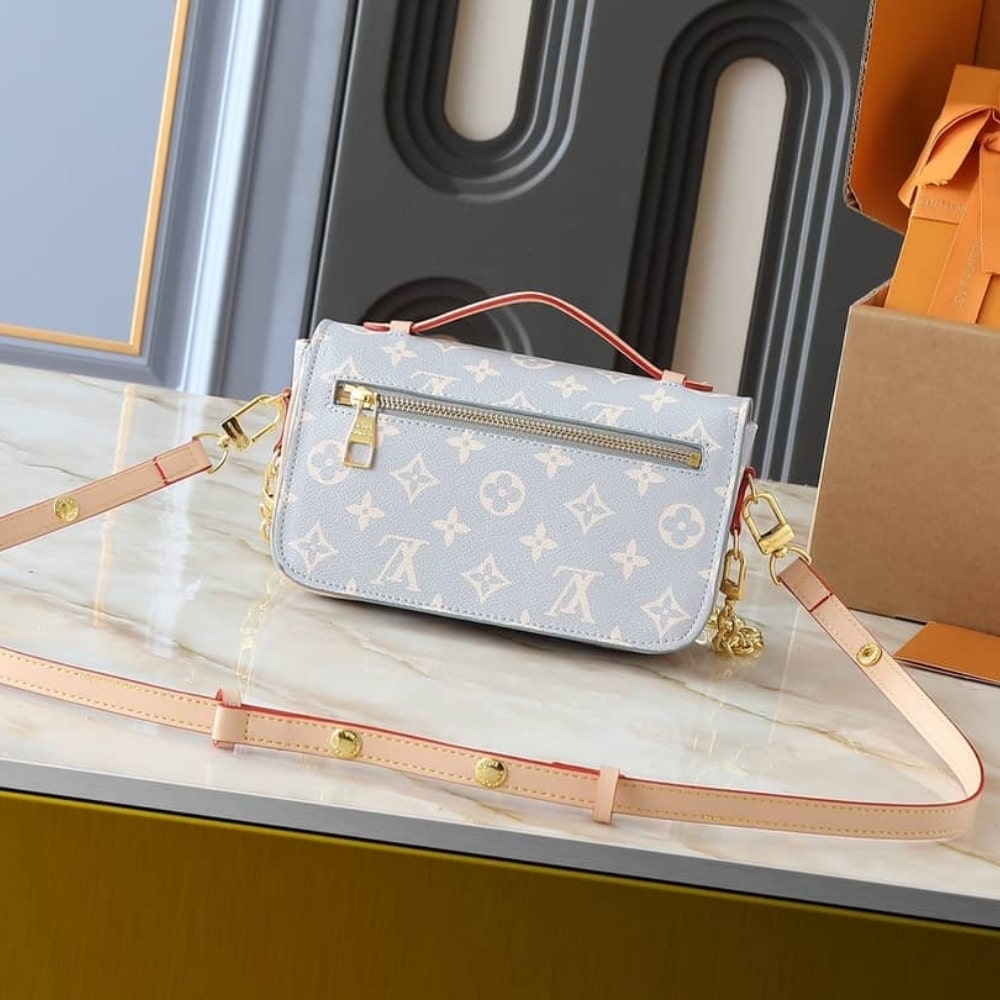 Louis Vuitton Pochette Métis East West Coated Canvas Trianon 21Cm M12429