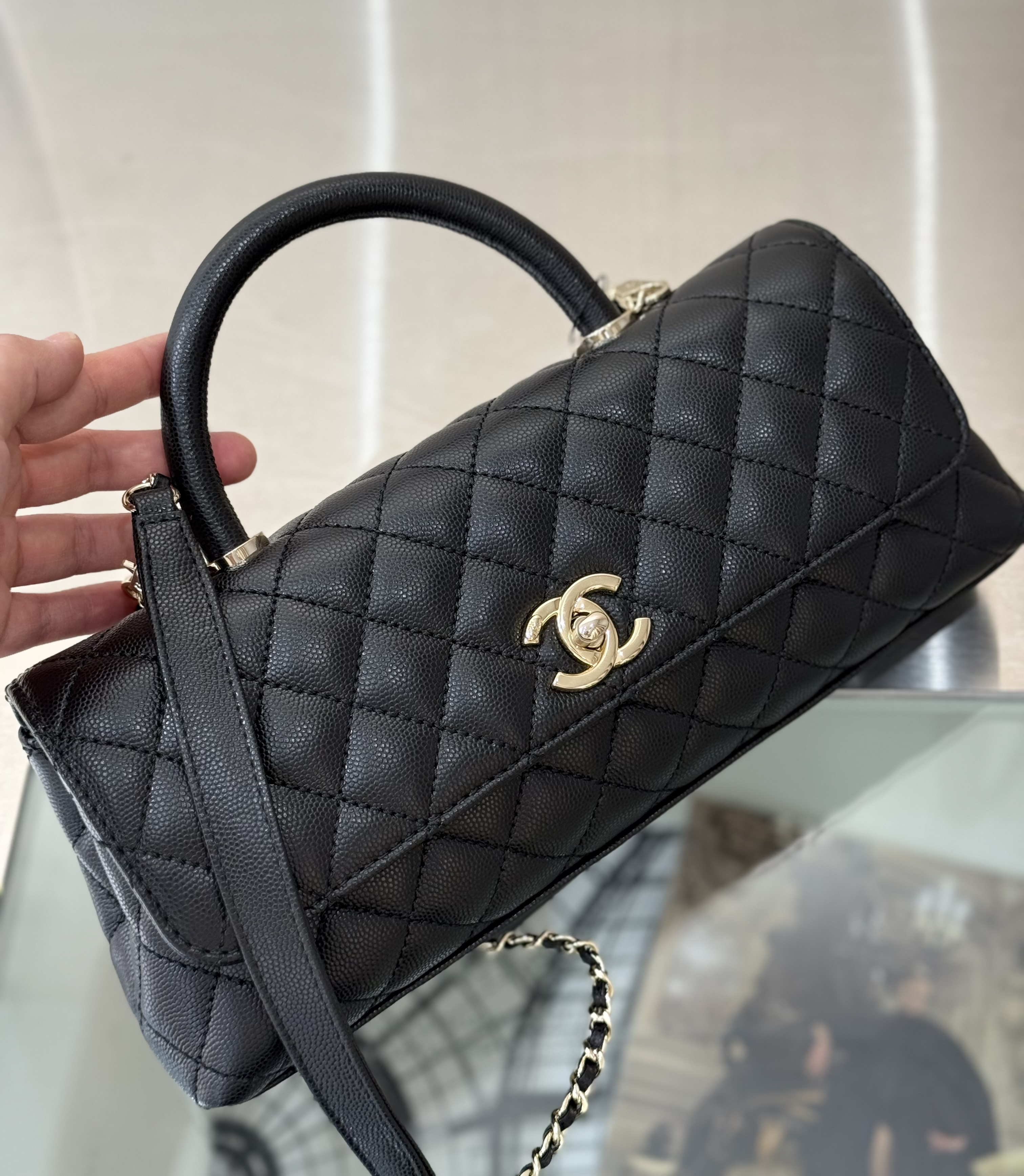 Cruise 2026 Black Quilted Grained Calfskin Top Handle Flap Bag with Gold-Tone Hardware & Chain Strap