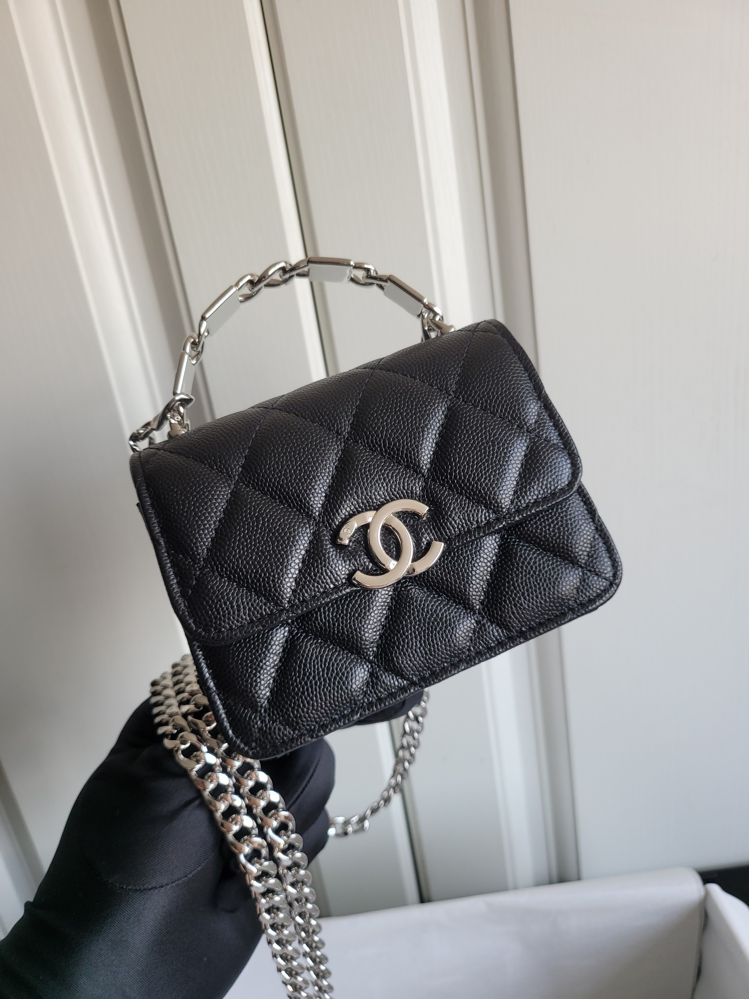 22S Mini Classic Flap Bag with Top Handle in Black Quilted Caviar Leather with Silver-Tone Hardware