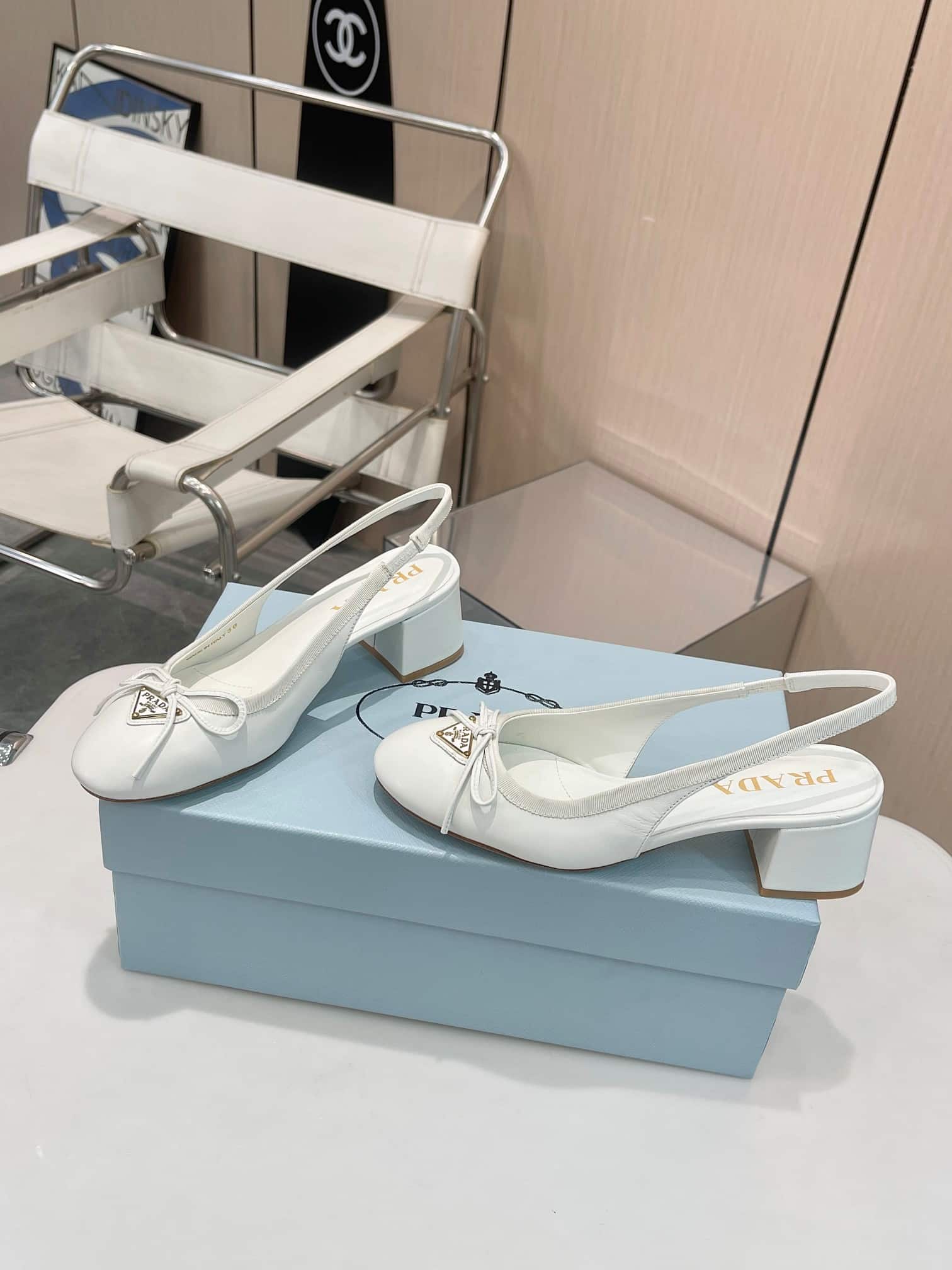 Prada Triangle Logo Bow Slingback Pump In White