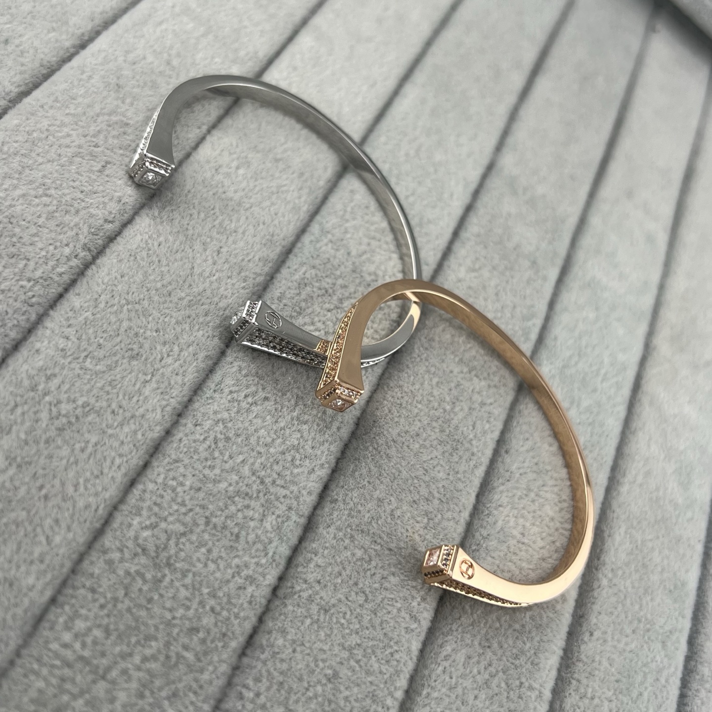 Square, trapezoidal, and conical diamond-encrusted bracelets