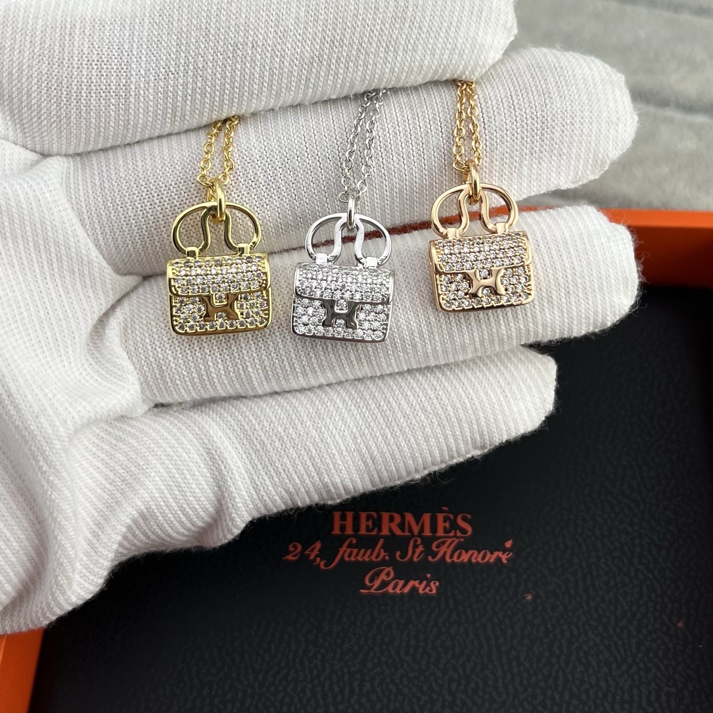 Diamond-encrusted bag clasp necklace