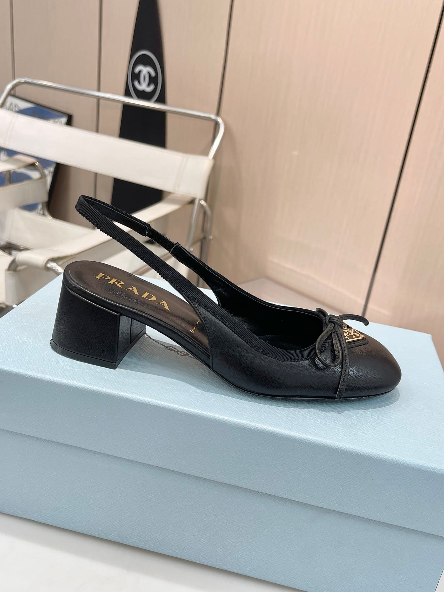 Prada Triangle Logo Bow Slingback Pump In Black