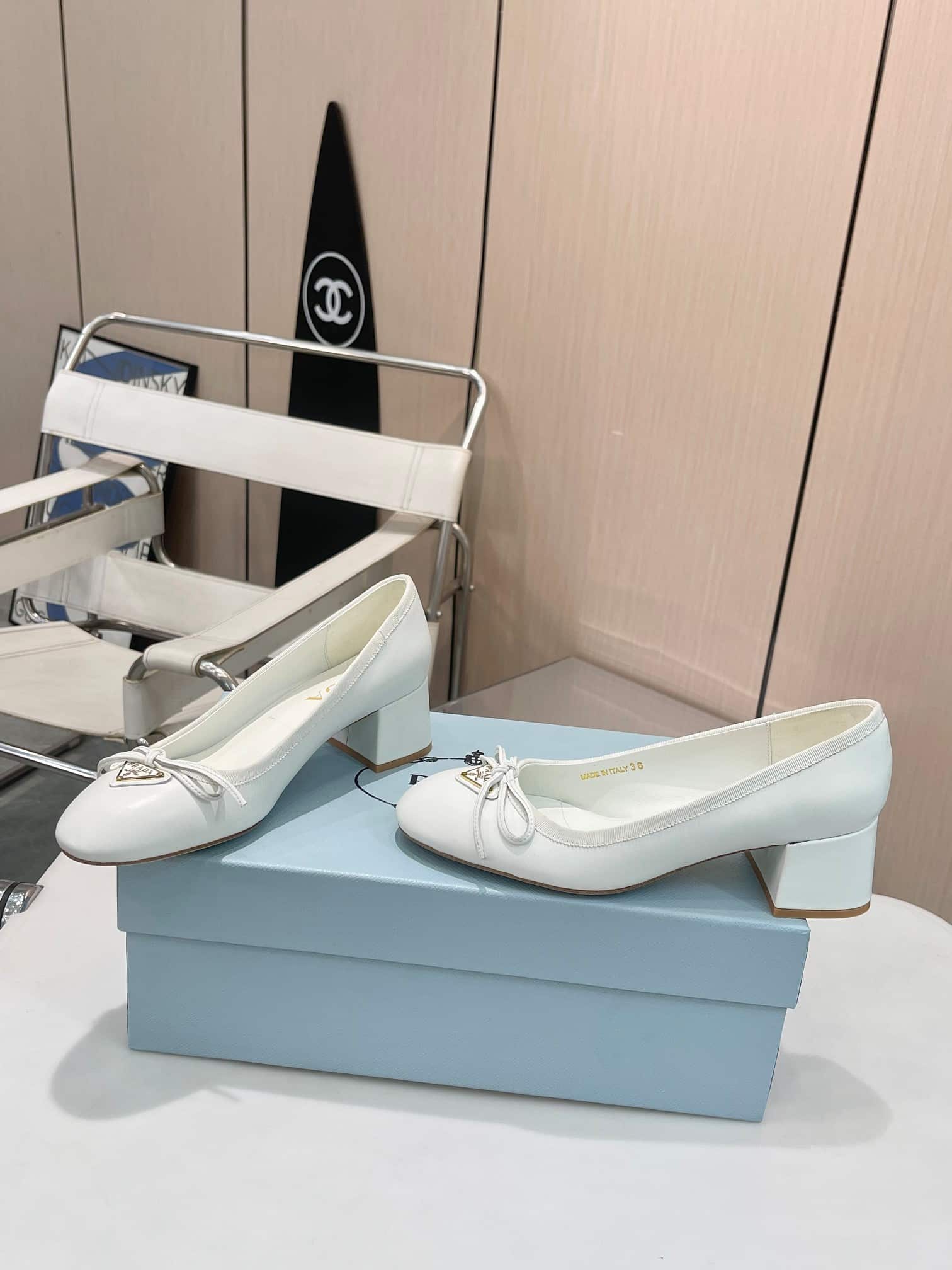 Prada Triangle Logo Bow Pump In White