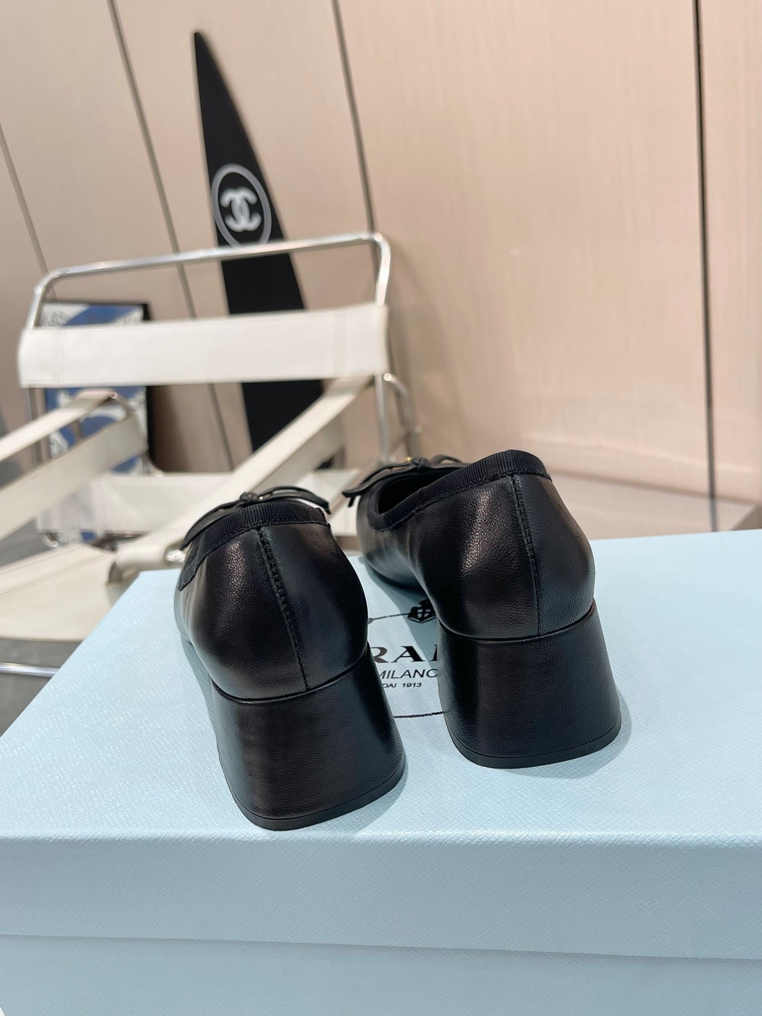 Prada Triangle Logo Bow Pump In Black