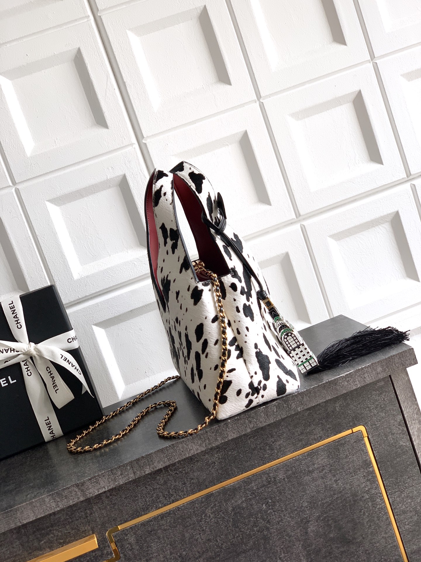 2026 Fall-Winter Runway Hobo Bag in Black & White Dalmatian Print Pony Hair with Gold-Tone Hardware & Empire State Building Tassel Charm