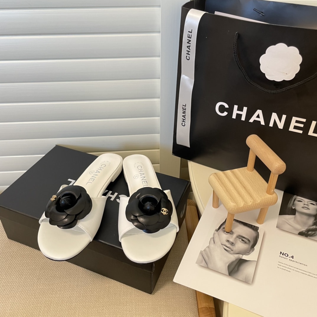 Chanel Black Camellia Slides White