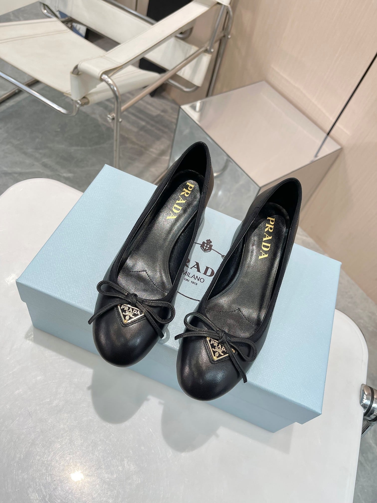 Prada Triangle Logo Bow Pump In Black