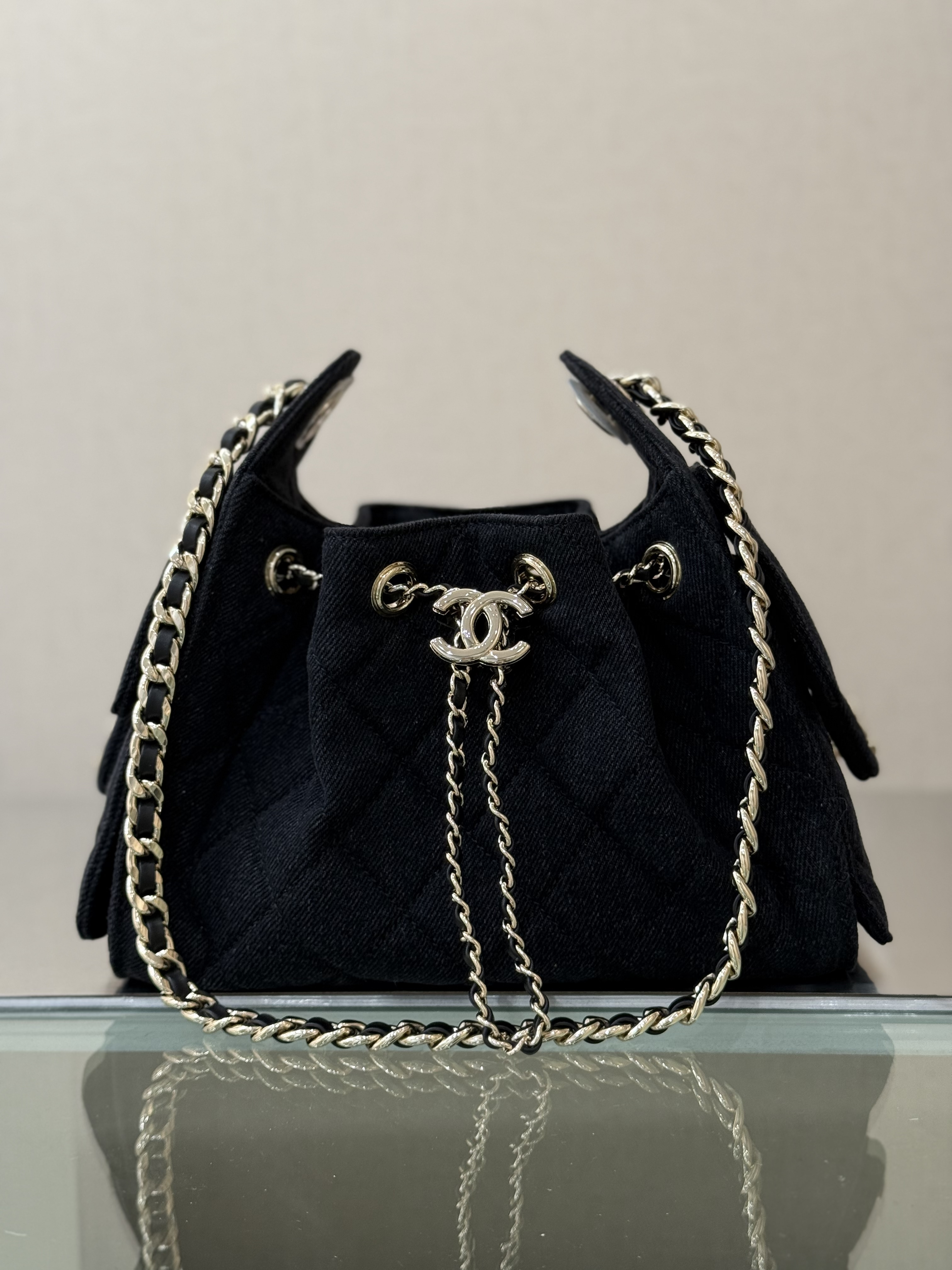 Spring-Summer 2025 Black Quilted Denim Drawstring Bucket Bag with Gold-Tone