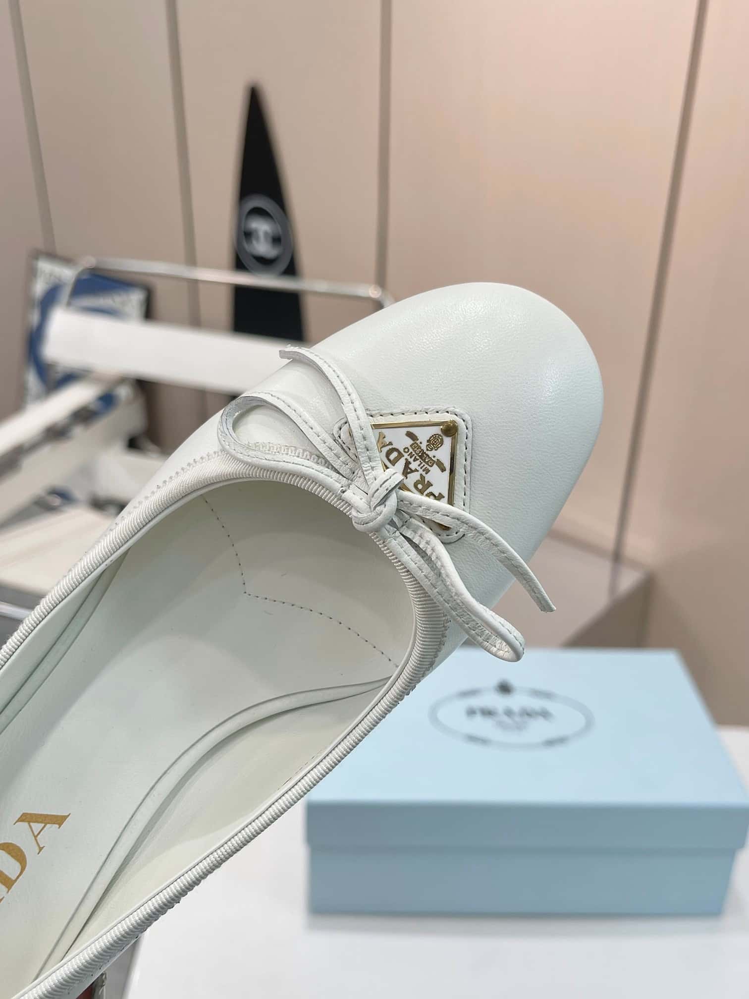 Prada Triangle Logo Bow Pump In White