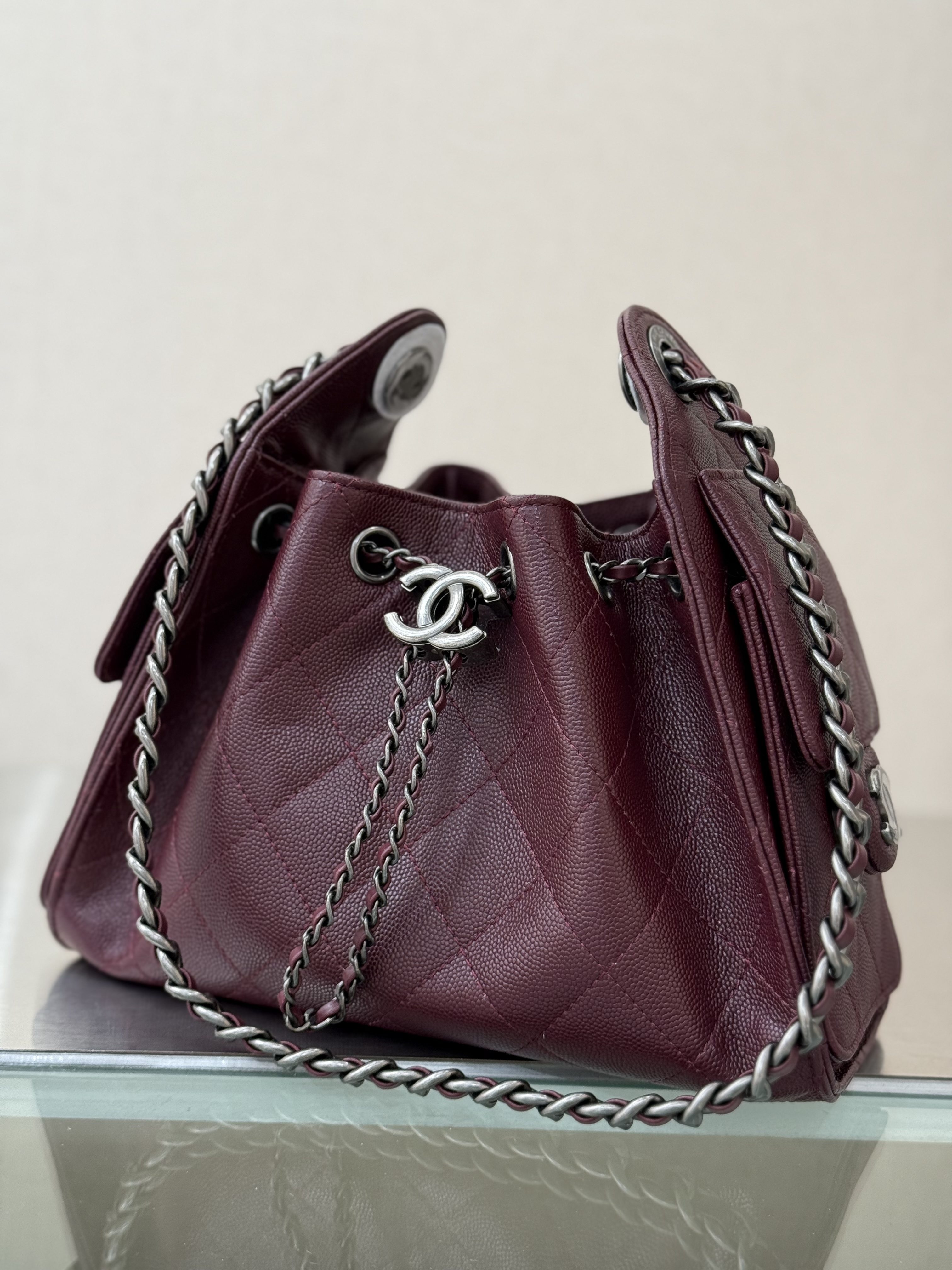 Spring-Summer 2025 Burgundy Quilted Grained Calfskin Drawstring Bucket Bag with Ruthenium-Finish Hardware