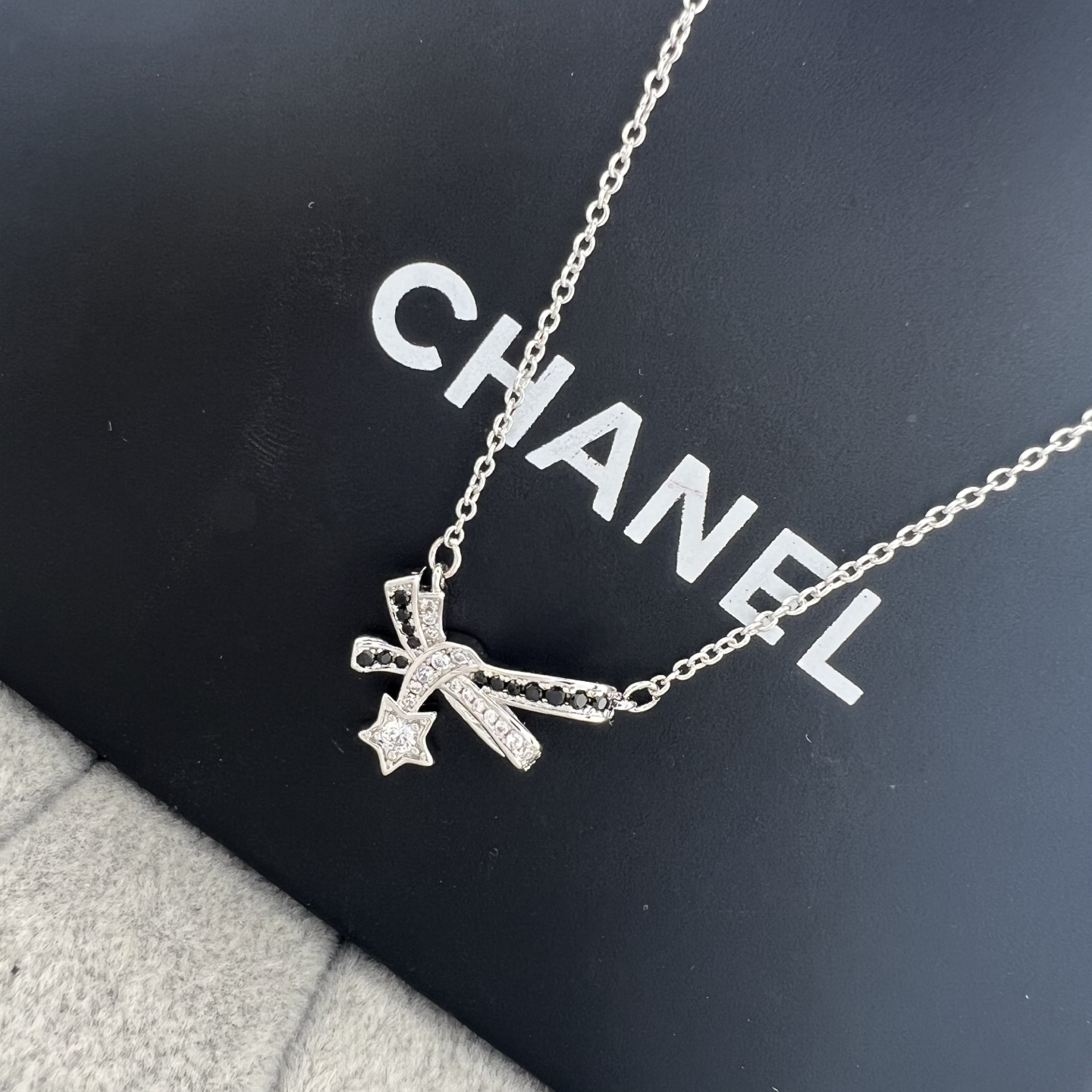 Platinum Comet Bow Necklace