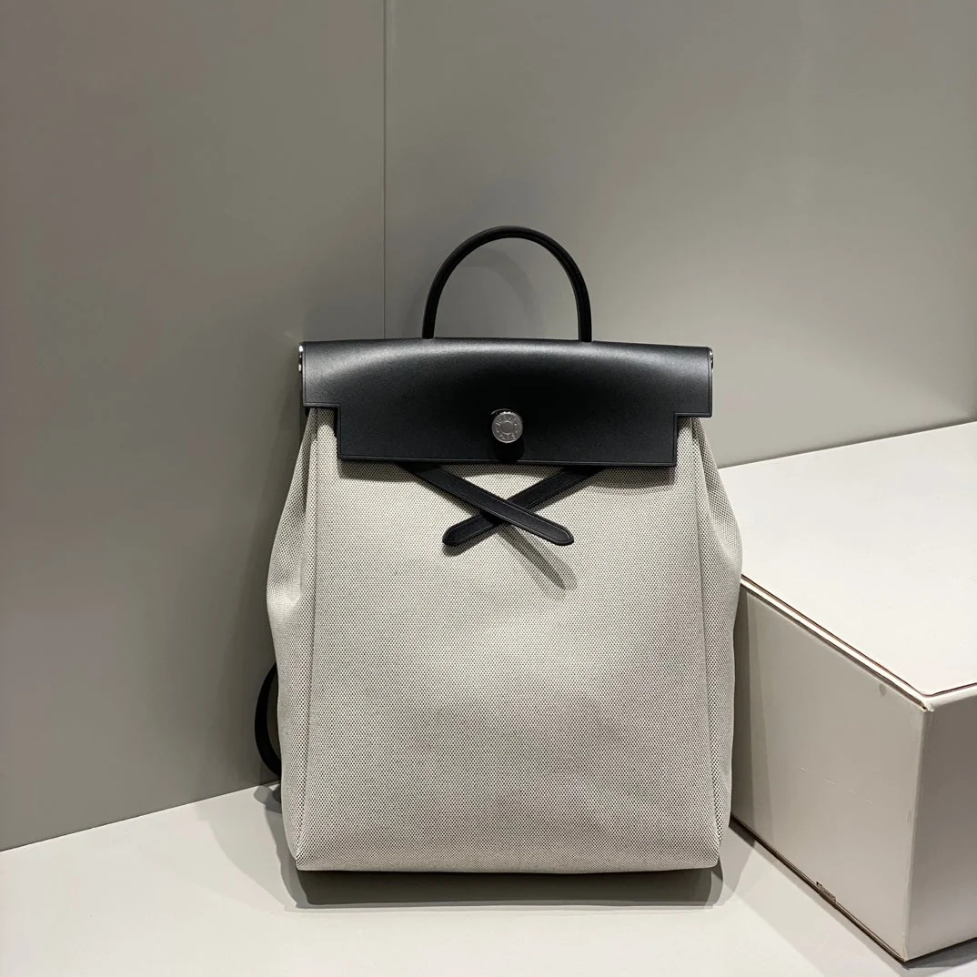 HERBAG A DOS ZIP RETOURNE BACKPACK 29 IN OFF-WHITE CANVAS AND BLACK CALFSKIN