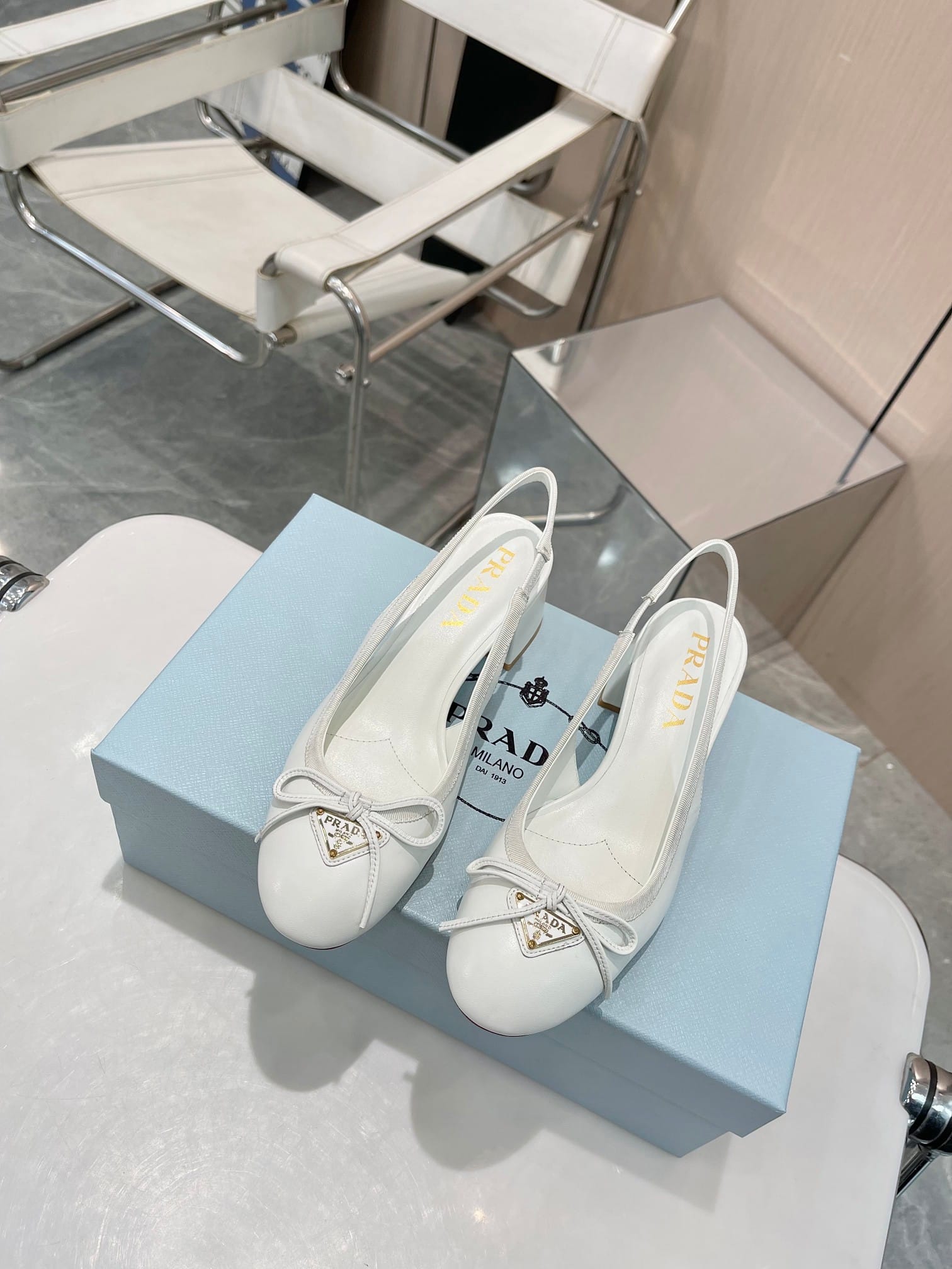Prada Triangle Logo Bow Slingback Pump In White