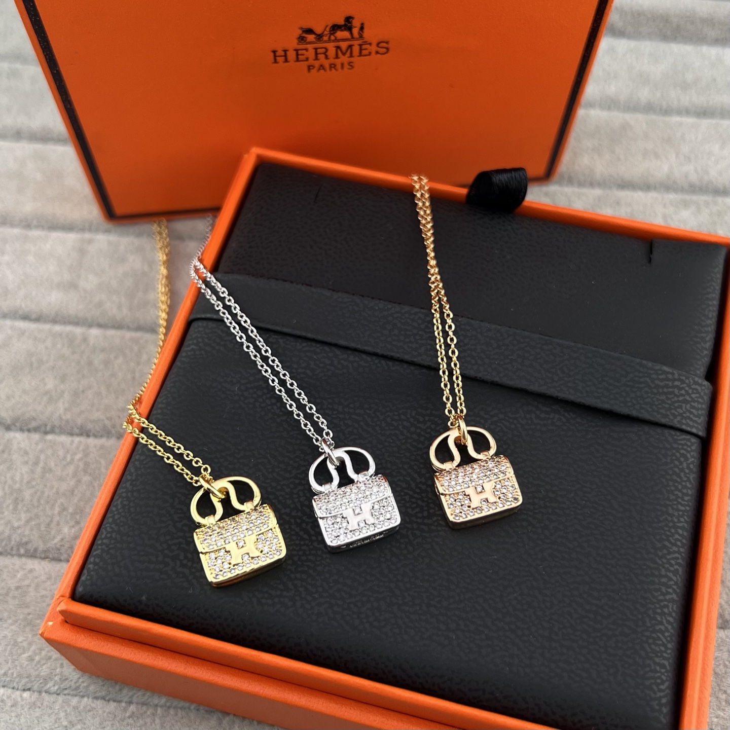 Diamond-encrusted bag clasp necklace