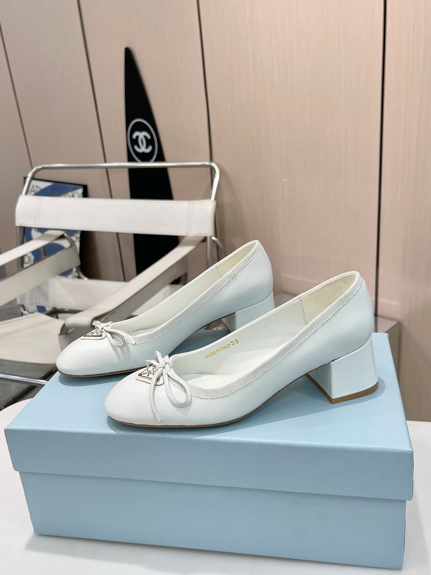 Prada Triangle Logo Bow Pump In White