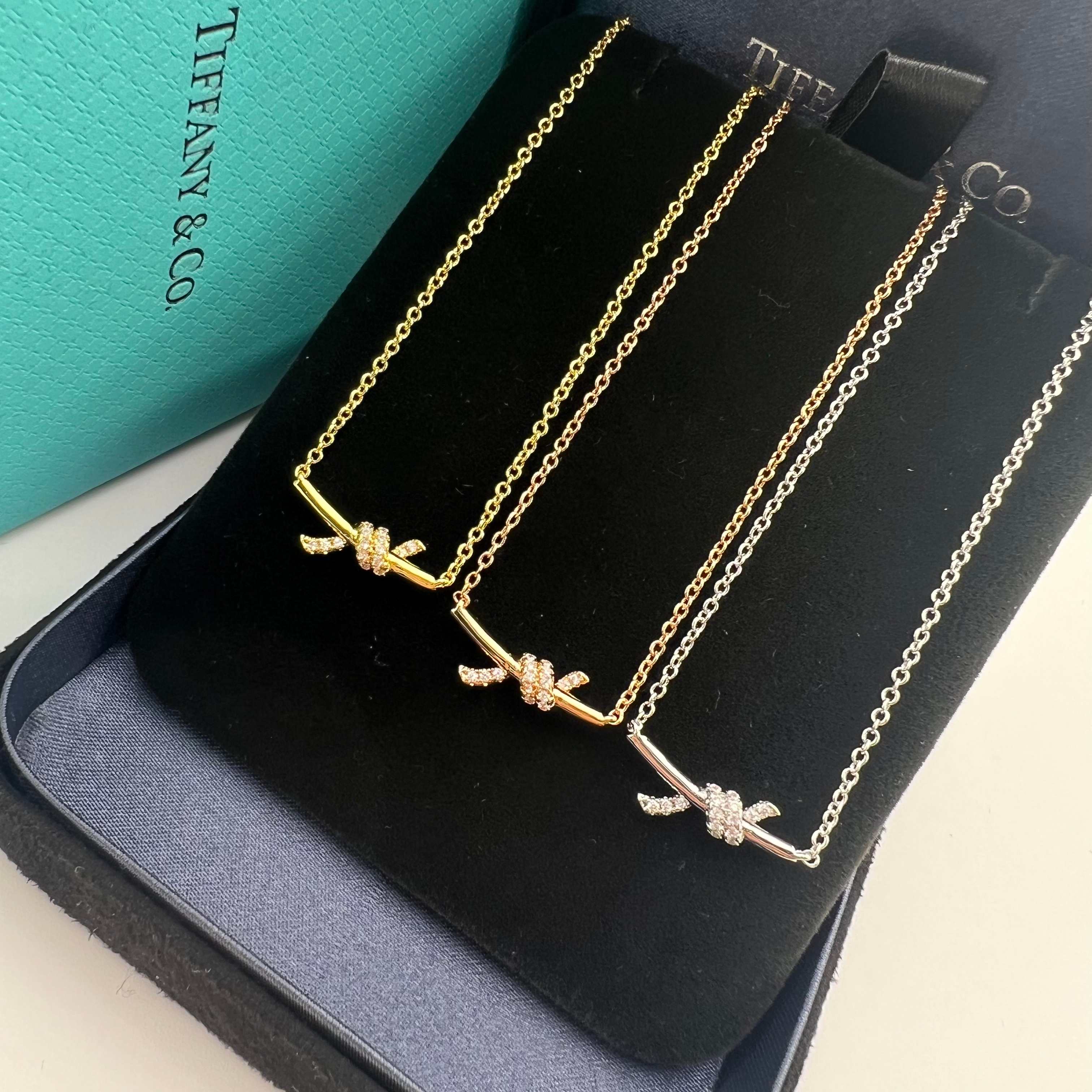 Small-sized diamond-encrusted twisted-knot collar necklace