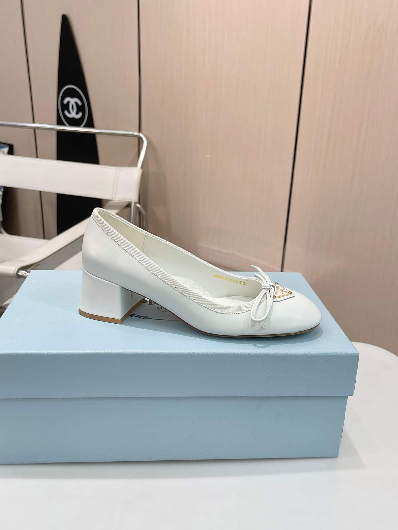 Prada Triangle Logo Bow Pump In White