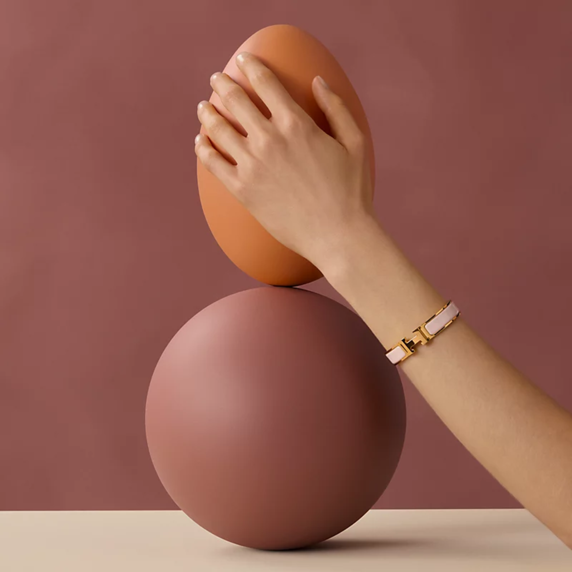 Hermes Clic H Bracelet in Gold and Pink