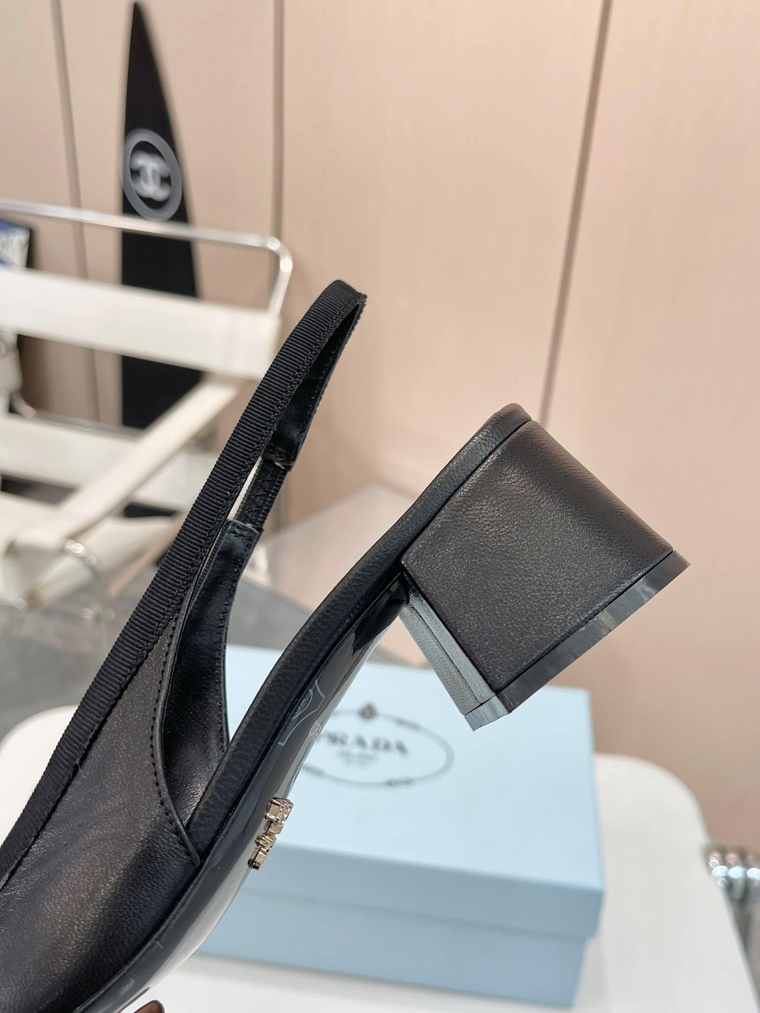 Prada Triangle Logo Bow Slingback Pump In Black