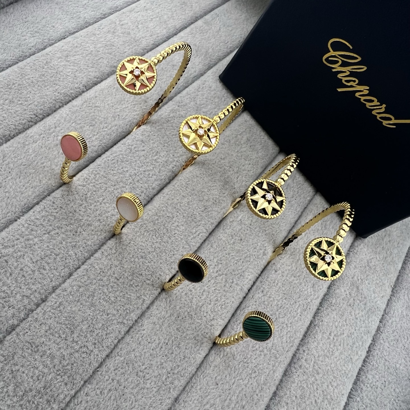 Gold-tone open cuff bracelet with mother-of-pearl eight-pointed star beads