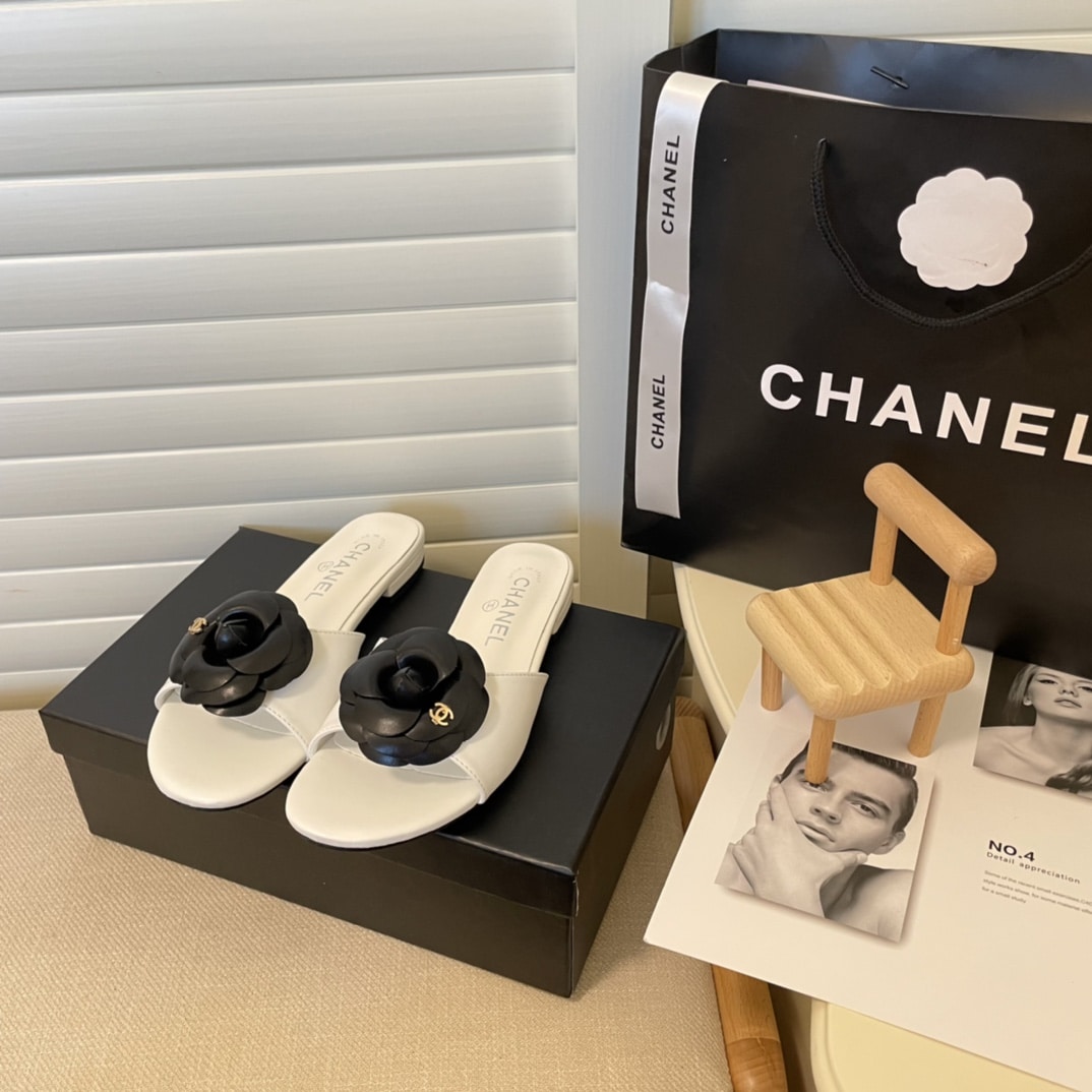 Chanel Black Camellia Slides White