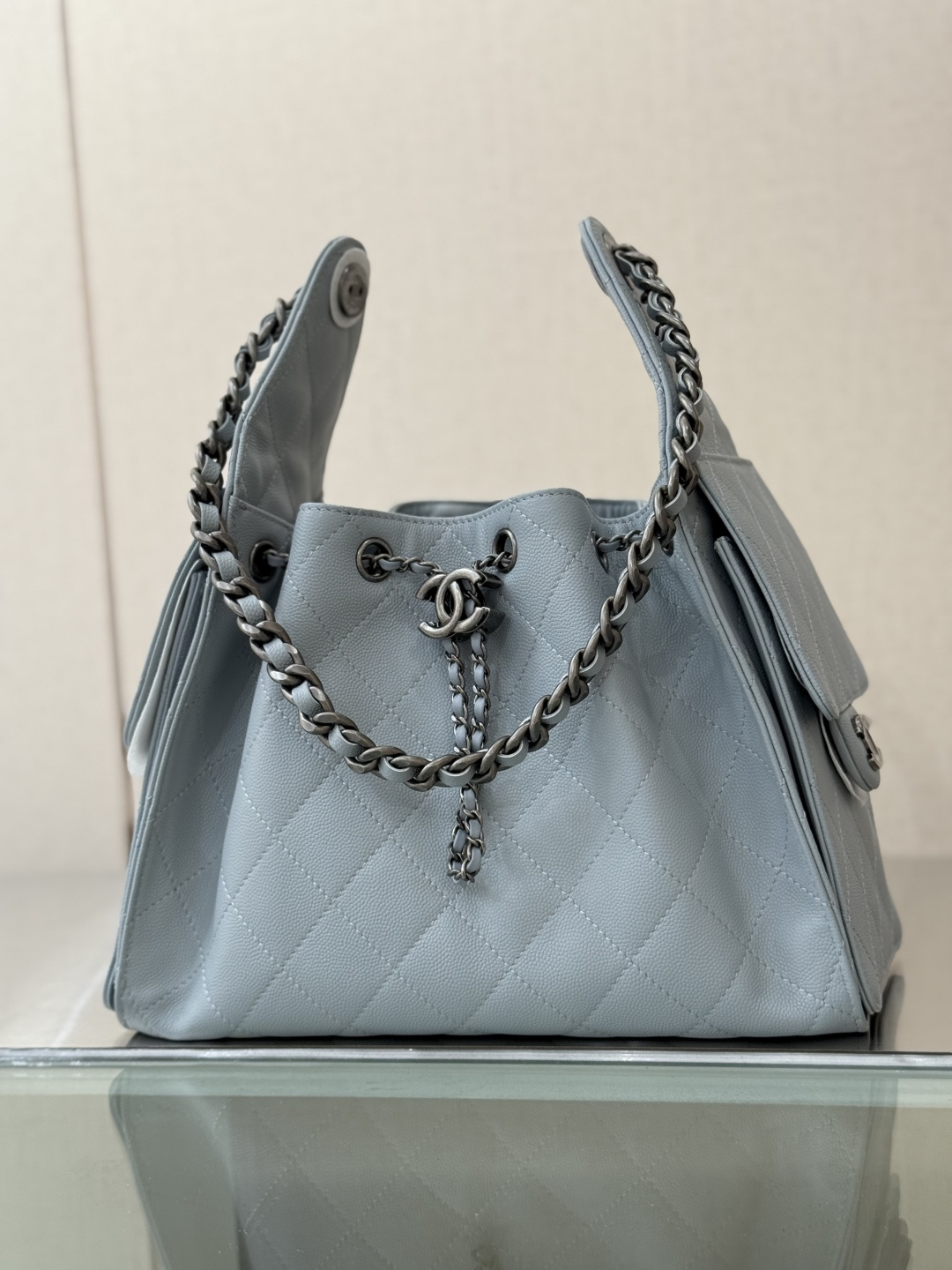 Spring-Summer 2025 Light Blue Quilted Grained Calfskin Drawstring Bucket Bag with Ruthenium-Finish Hardware
