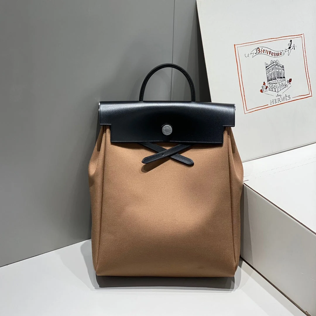 HERBAG A DOS ZIP RETOURNE BACKPACK 29 IN BROWN CANVAS AND BLACK CALFSKIN