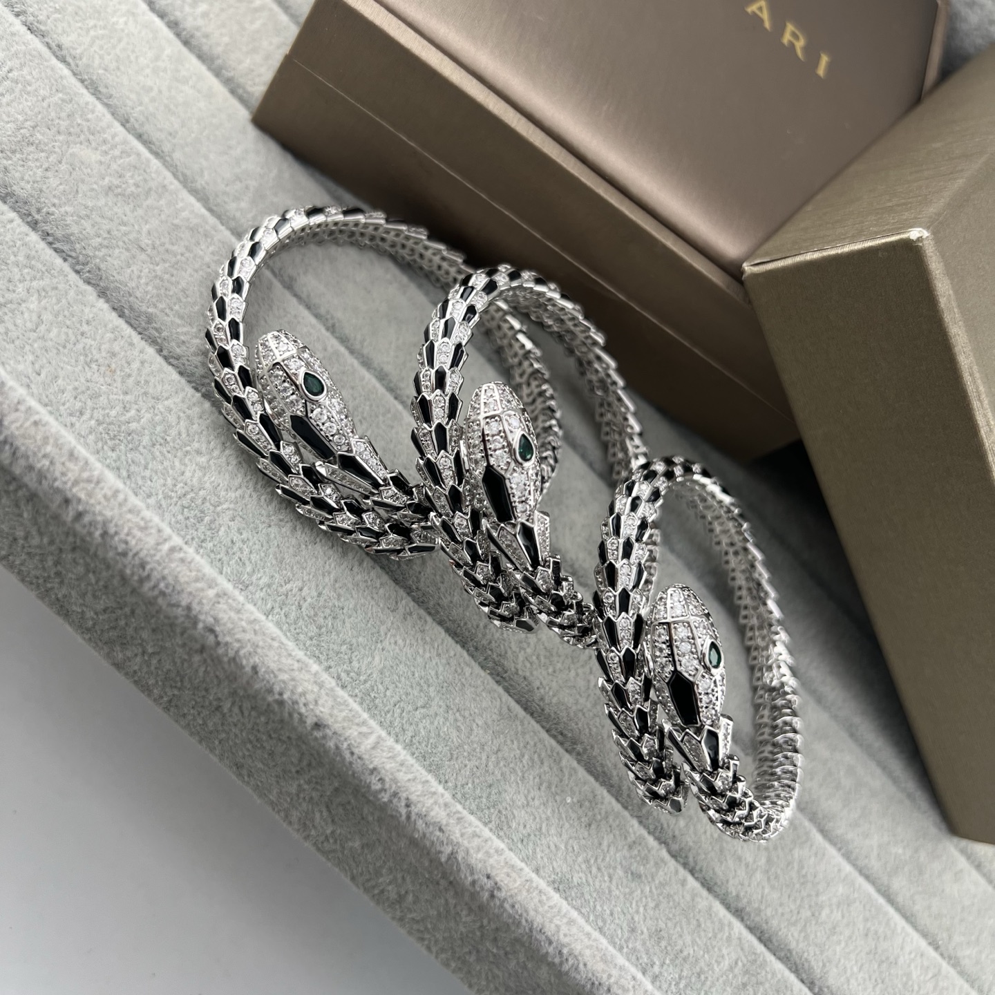 Serpentine black onyx and diamond coil-arm spring bracelet