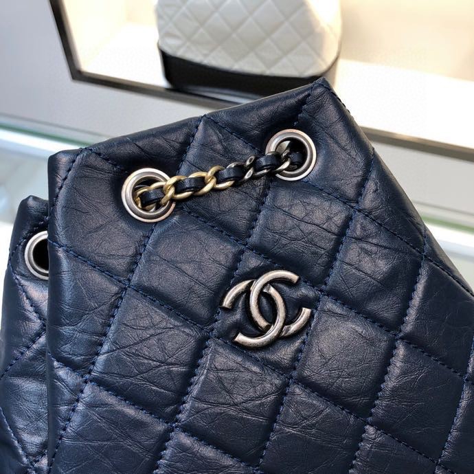 Gabrielle Small Quilted Aged Calfskin Backpack in Navy Blue & Black