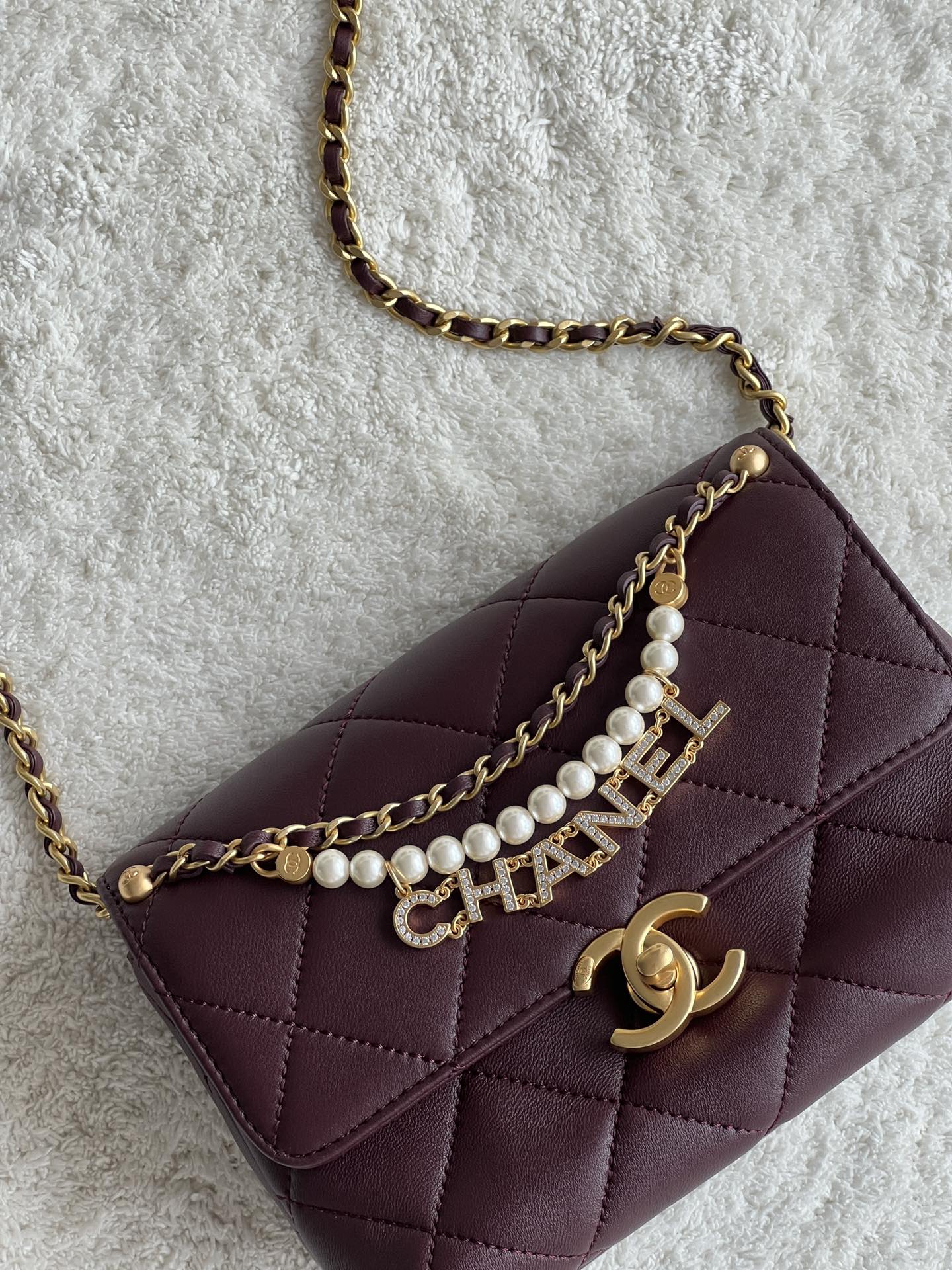 24A Mini Classic Flap Bag in Burgundy Quilted Lambskin with Pearl & Crystal CHANEL Letter Chain and Light Gold-Tone Hardware (AS4997)