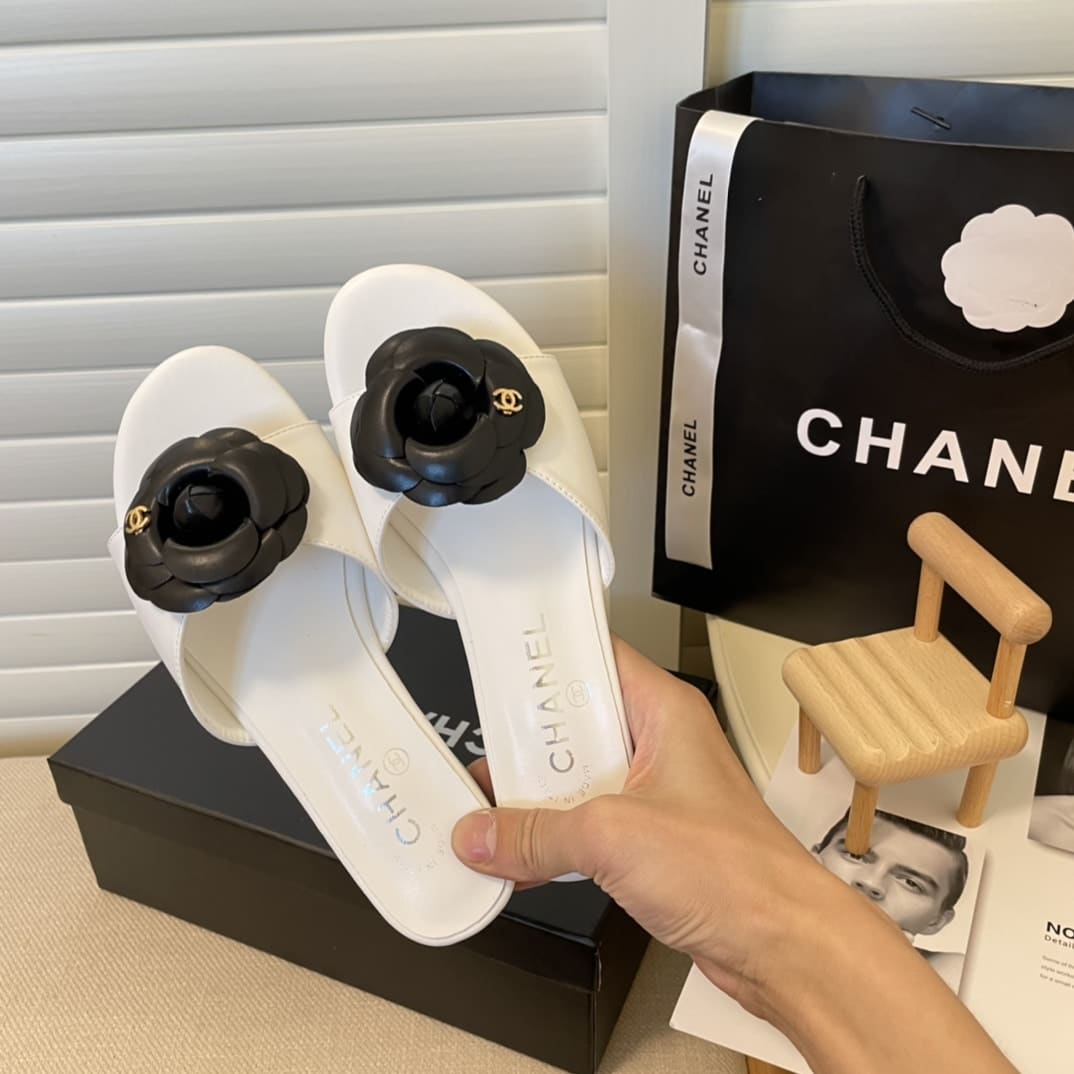 Chanel Black Camellia Slides White